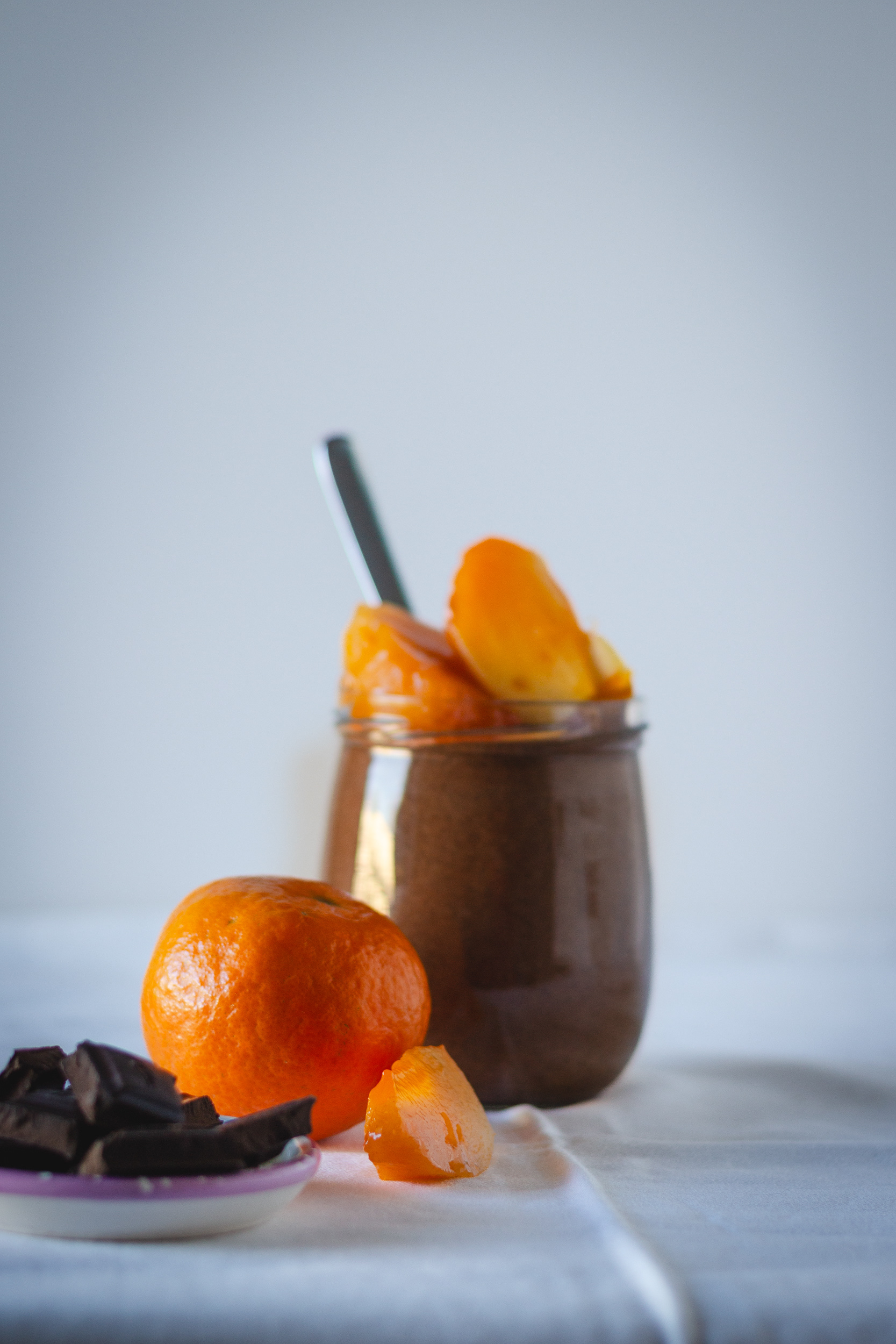 Vegan chocolate cream with persimmon and clementine