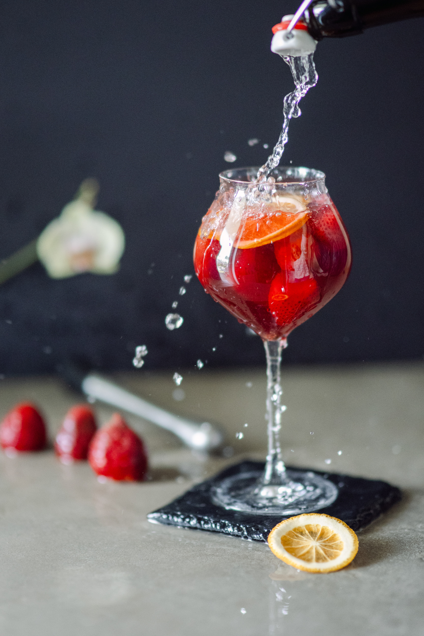 Strawberry mocktail with a mineral water pouring splash
