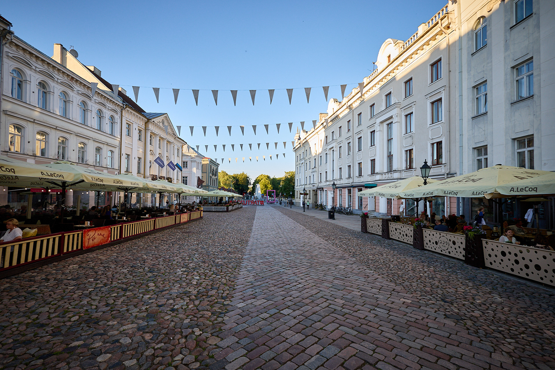 Ancient old town Tartu - main wide street at summer day, pre-sunset