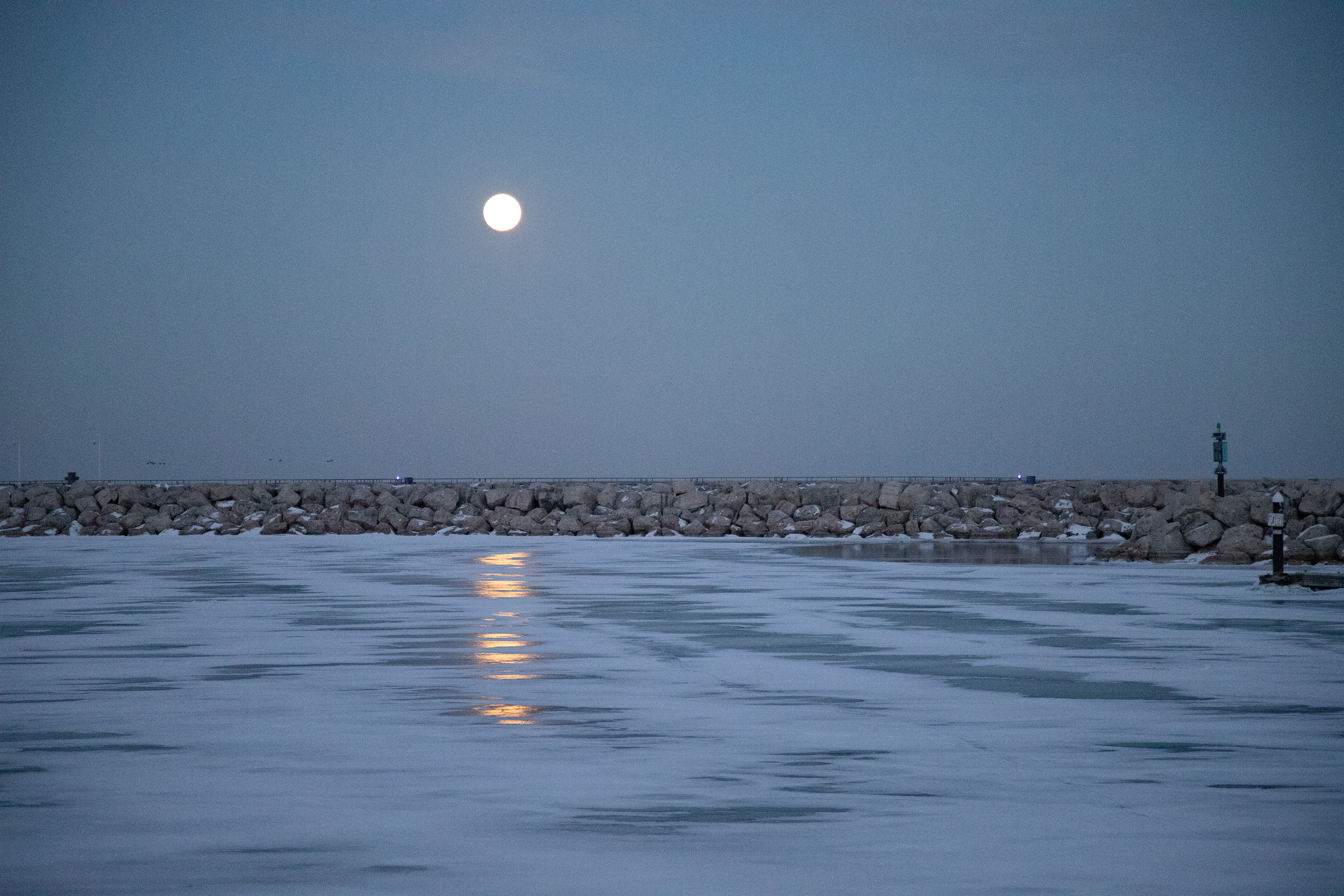 Winter moonlight defining the shoreline February 1, 2026 — Discovery World, Milwaukee