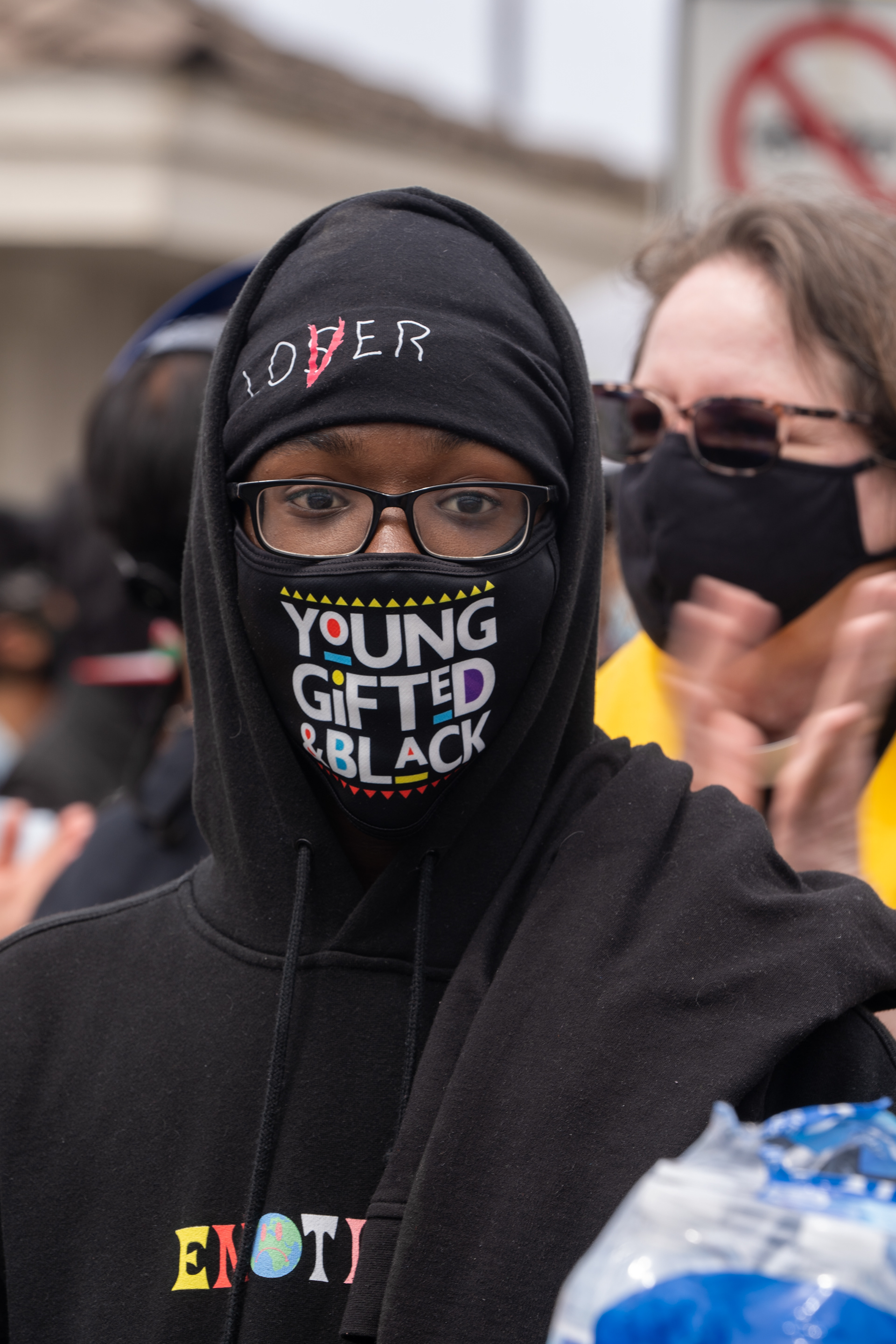 A young Black Lives Matter supporter looks on as the crowd applauds a speaker. Sunday, April 11, 2021. (Photo by Solomon O. Smith/ The Valley Star) 