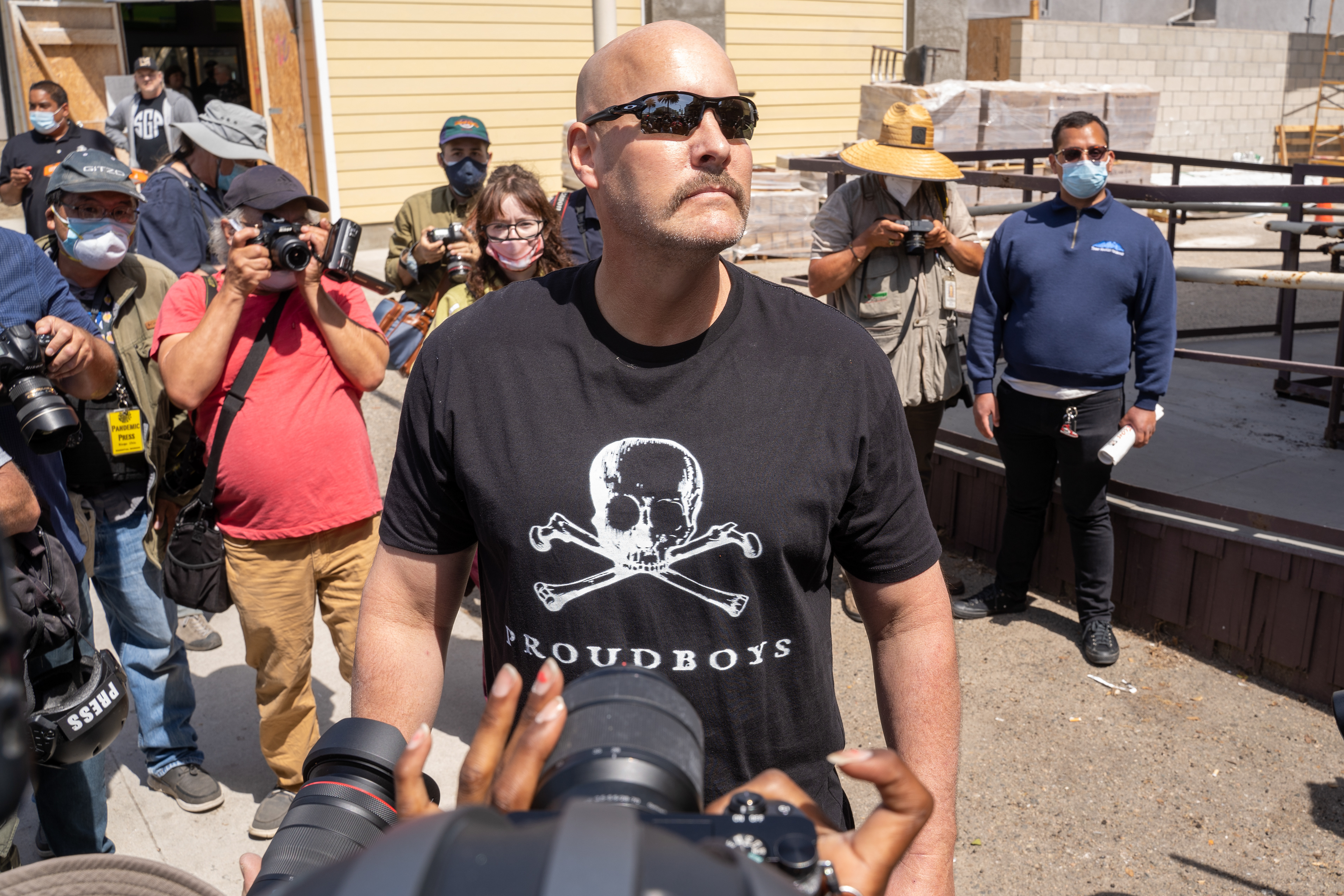 Basking in the attention, a member of the Proud Boys, a white spramecist known for using violence, stands to pose for photos. The groups members are also known for their attempted use of the press and social media. Sunday, April 11, 2021. (Photo by Solomon O. Smith/ The Valley Star)