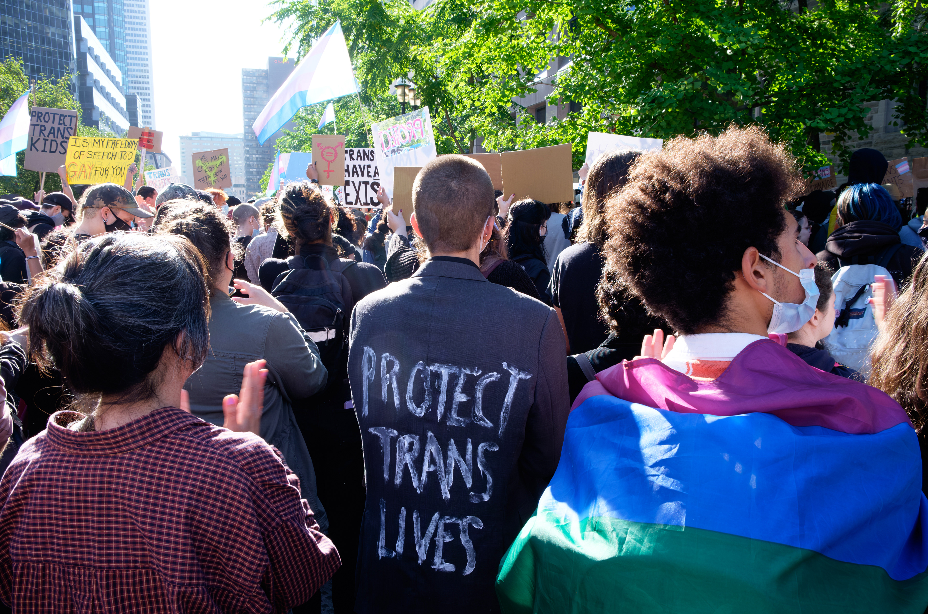 Protect Trans Lives. Counter-protesting an anti-trans demonstration. On the traditional territory of the Kanienʼkehá꞉ka (Mohawk) Nation of the Haudenosaunee Confederacy. No song pairing.