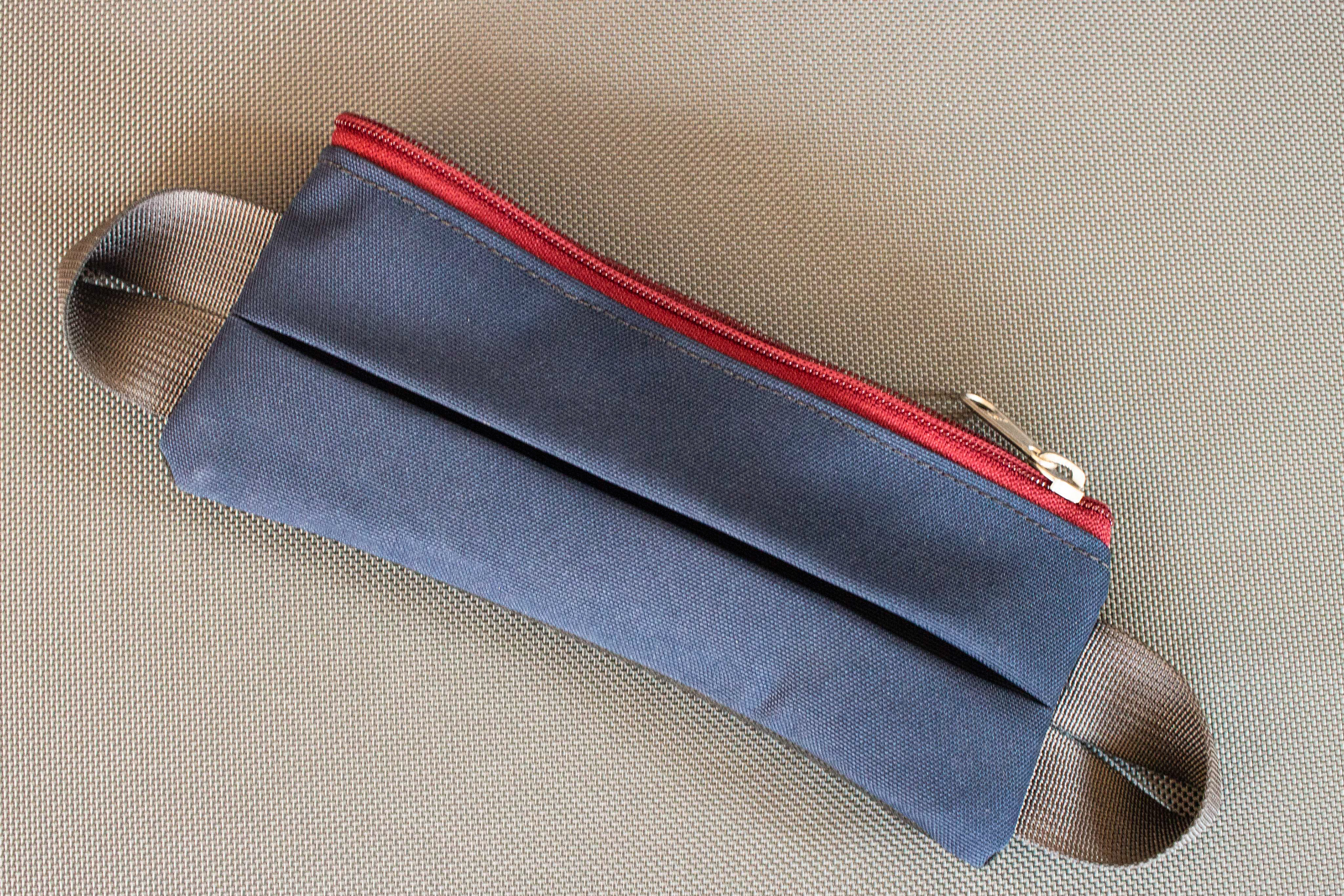 Pleated expanding accessory pouch