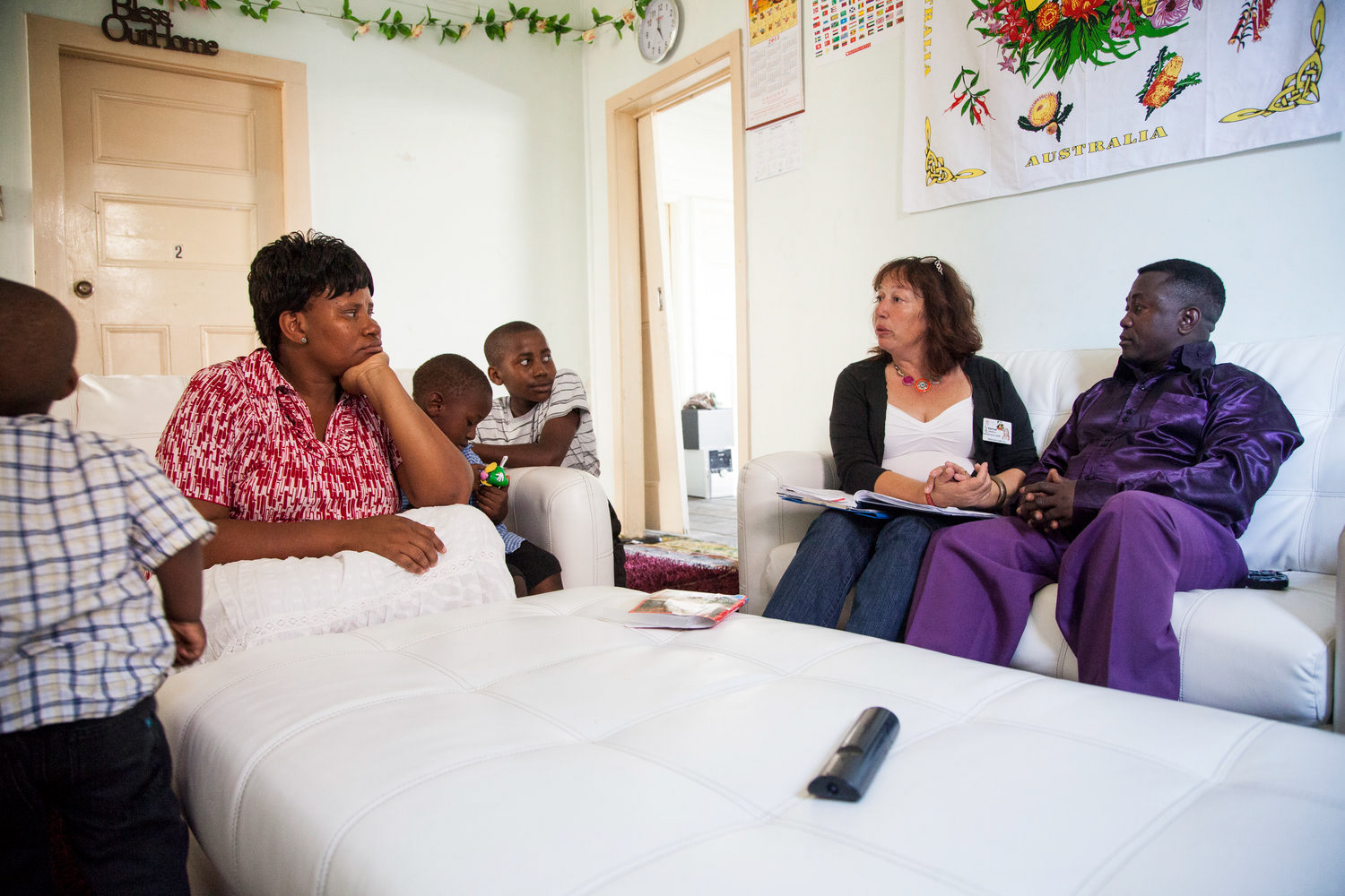 Karinne Andrich conducts a home visit with a refugee family from the Democratic Republic of the Congo (ORC).