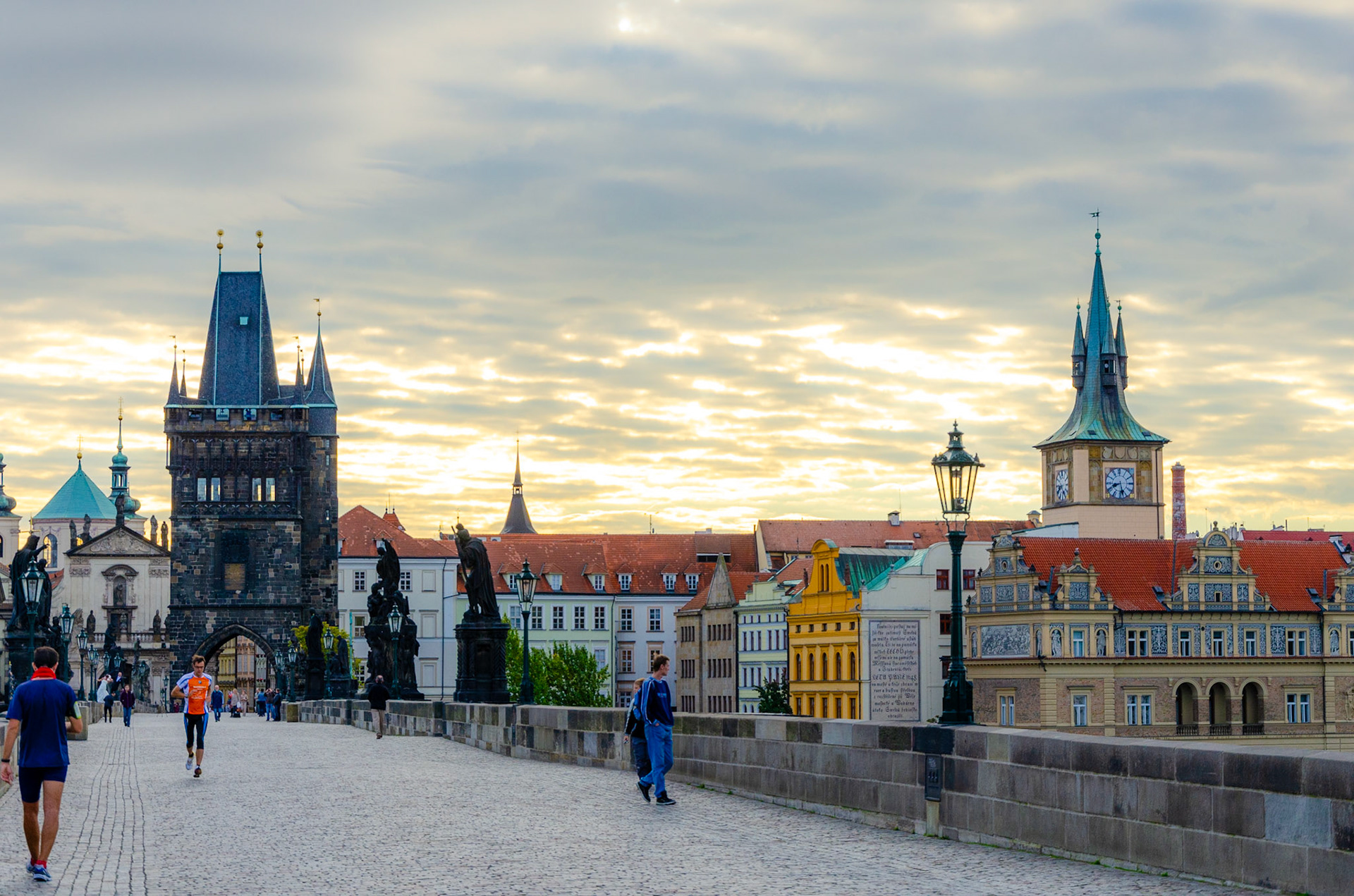 Early morning runner on Charles bridge in Prague, Czech Republic