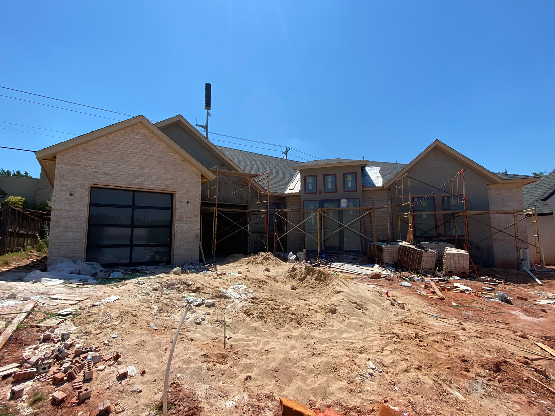 In the middle of placing brick and stucco