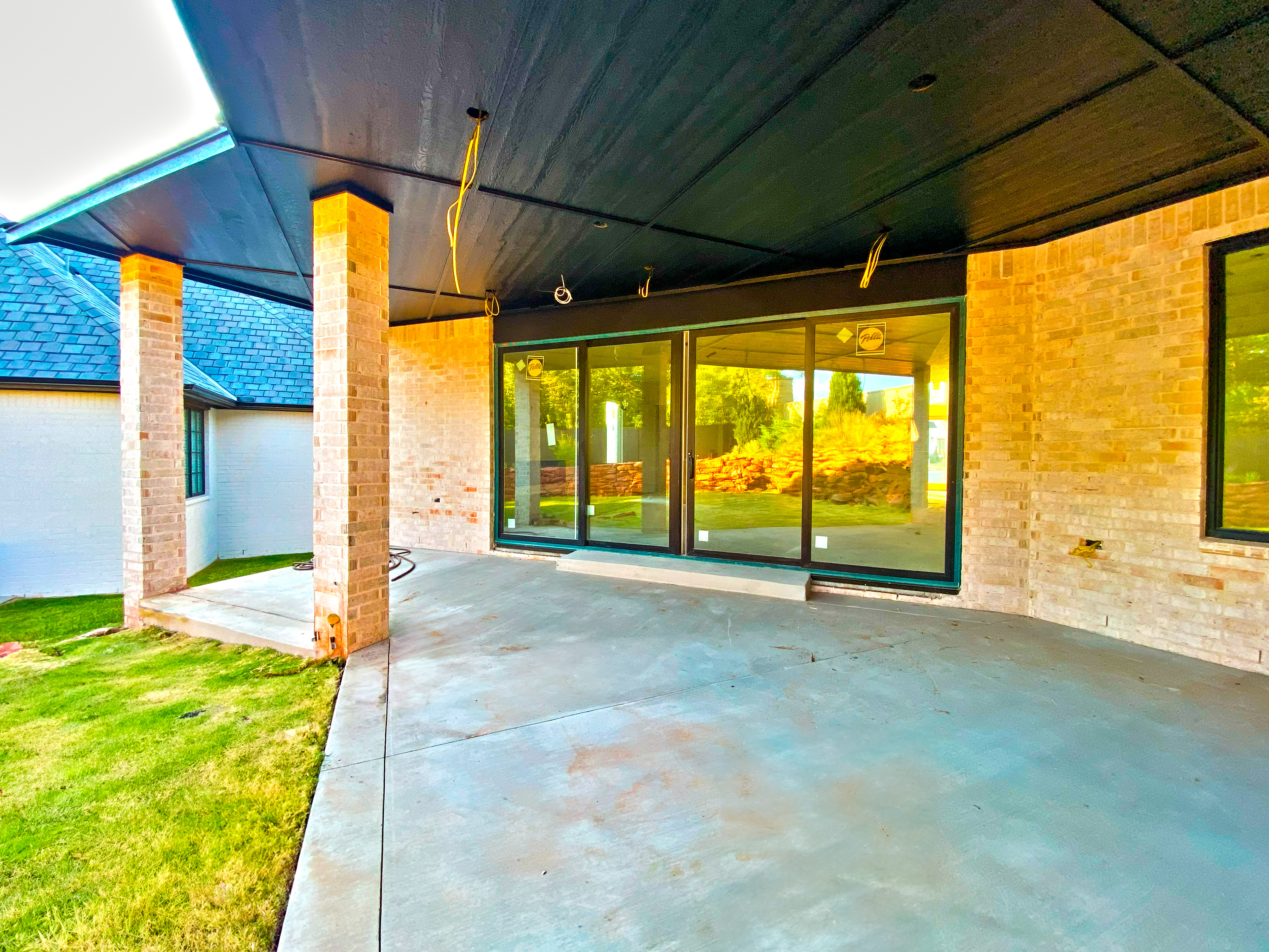 Back patio with sliding doors. Access to the living area and kitchen