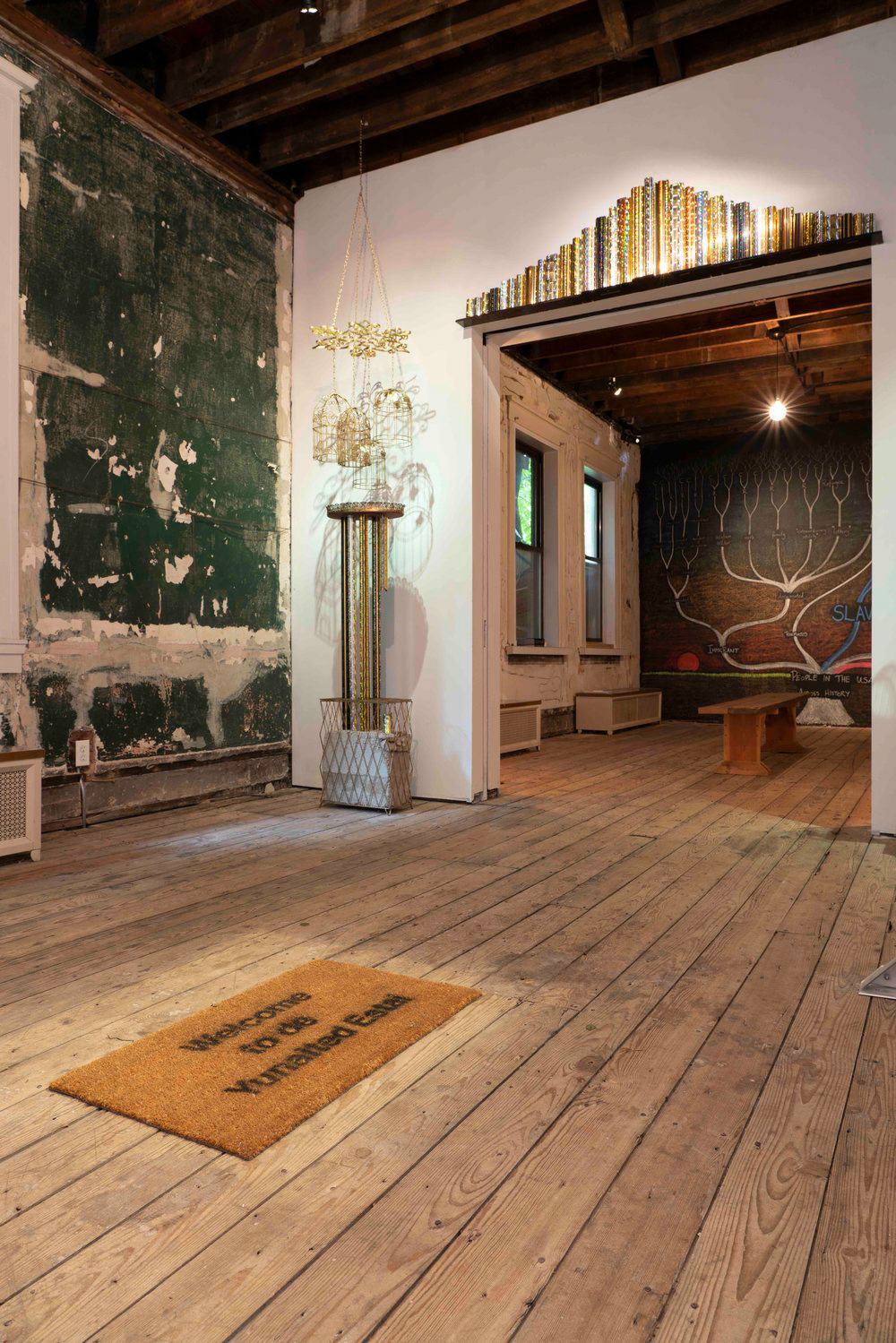 Welcome to the yunaited estai by Esperanza Mayobre (foreground); The Promise by Benjamin Larose (middle), Sunset on the American Dream by Eugenia Cheng (background)