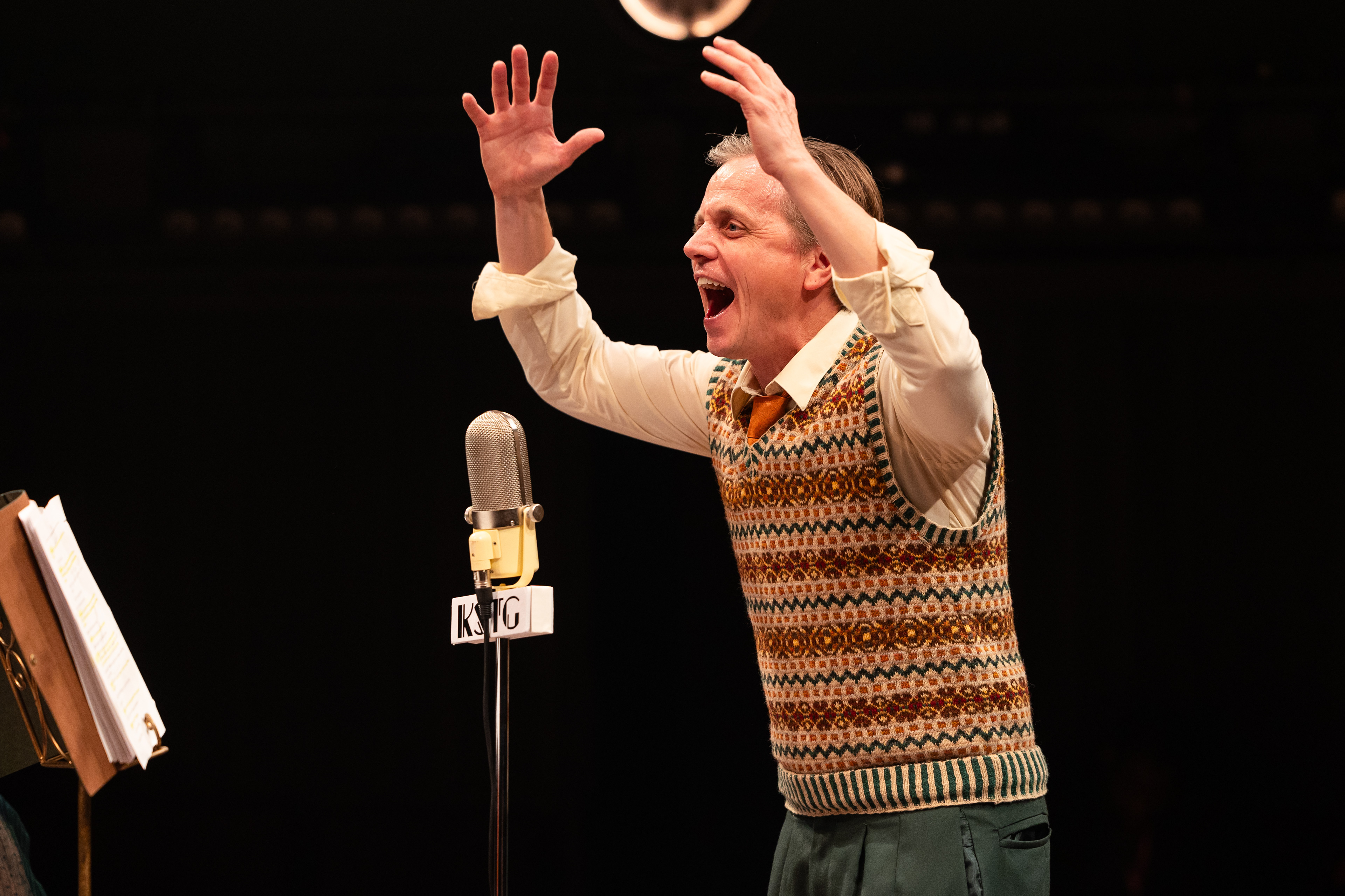 It’s A Wonderful Life: A Live Radio Play   stageshouston.com  WRITTEN BY: JOE LANDRY DIRECTED BY: DEREK CHARLES LIVINGSTON BASED ON THE STORY "THE GREATEST GIFT" BY PHILIP VAN DOREN STERN PRODUCERS: AMY SUTTON AND GARY CHILES  Photo courtesy of Stages Pictured: Cast of It's a Wonderful Life: A Live Radio Play, Stages (2025). Photo by: Melissa Taylor  CREATIVE TEAM Stage Manger: Carlos Cantu Scenic & Properties Designer: Jodi Bobrovsky Lighting Designer: Bryan Ealey Costume Designer: Leah Smith Sound Designer: Robert Leslie Meek Wig Stylist: Gisell Rubio  CAST VIOLET, et al: DeShae LaShawn Mary, et al: Jillian Linton Potter, et al: Gabriel Regojo George Bailey: Ryan Schabach Joseph, et al: Christopher Szeto-Joe  Clarence, et al: Pamela Vogel