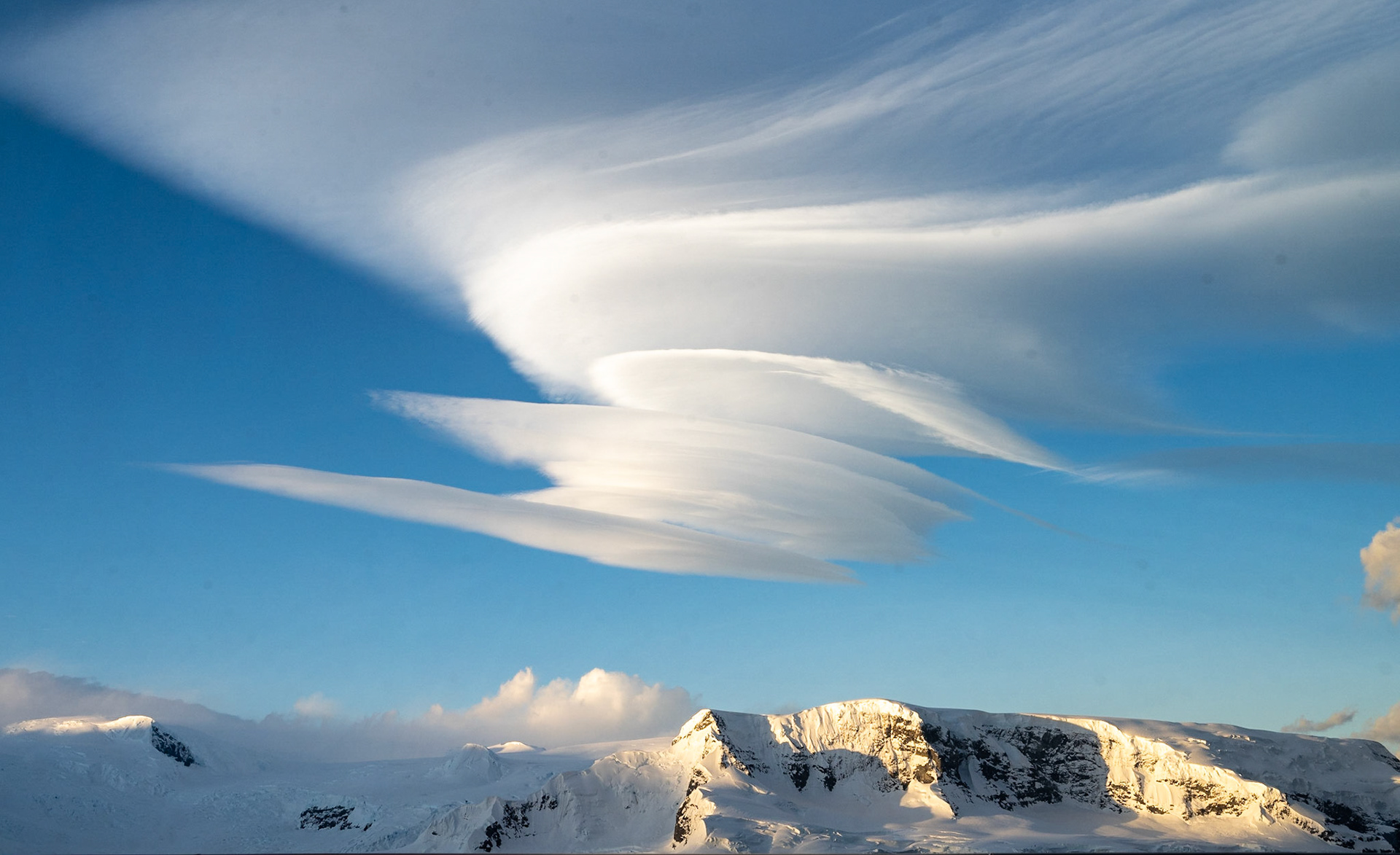 Lenticular clouds stacked over Lecointe Island