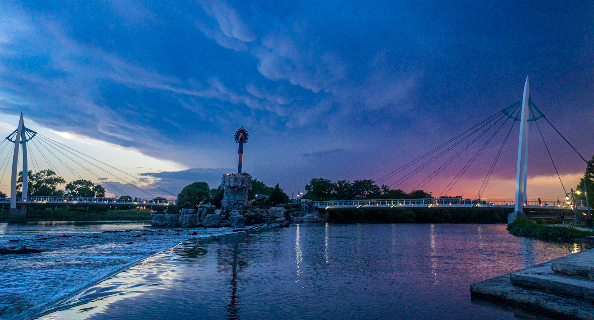 At the confluence of the Big and Little Arkansas Rivers in Wichita the focal point is Black Bear Bosin’s iconic sculpture, “Keeper Of The Plains”. 