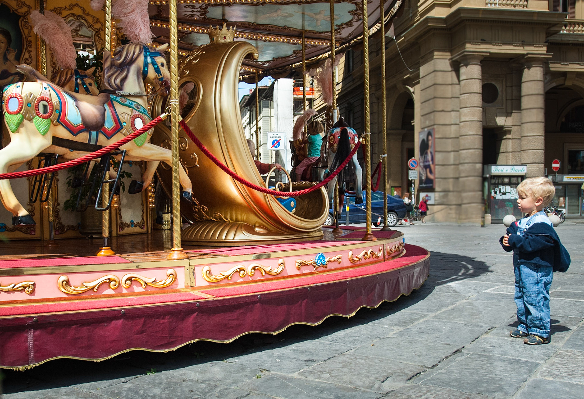 A carousel has been a long-time fixture on Florence’s Piazza della Repubblica and this is a good place to photograph children entranced by the colors and the motion of the ride.  May, 2007