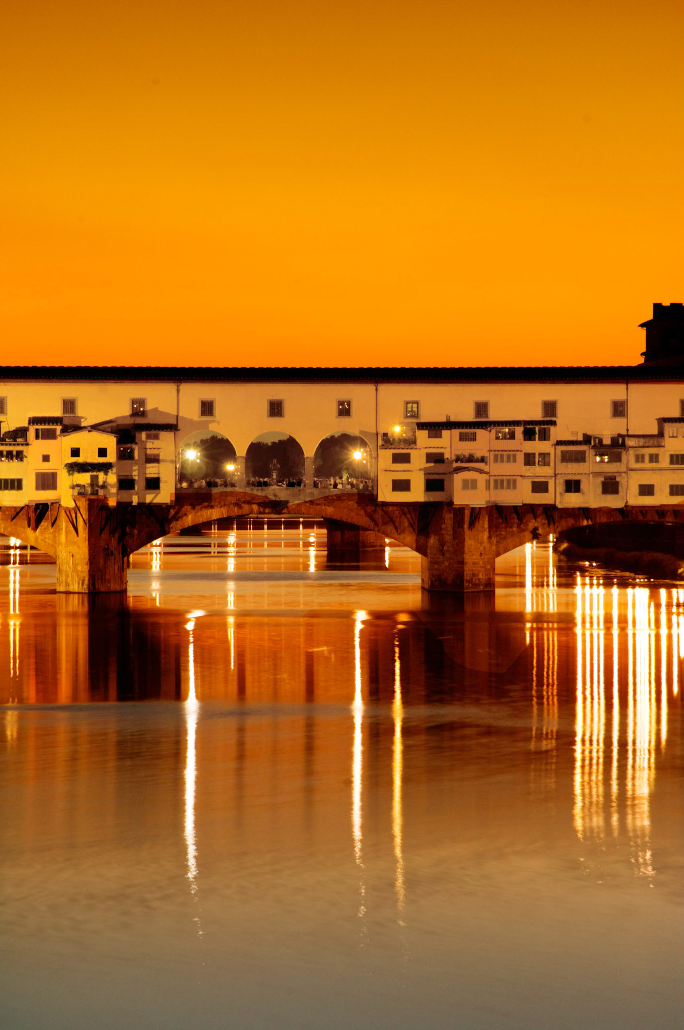 The Ponte Vecchio is the oldest of the bridges crossing the Arno in the heart of Florence.  This image is about an hour after sunset,  May 2007