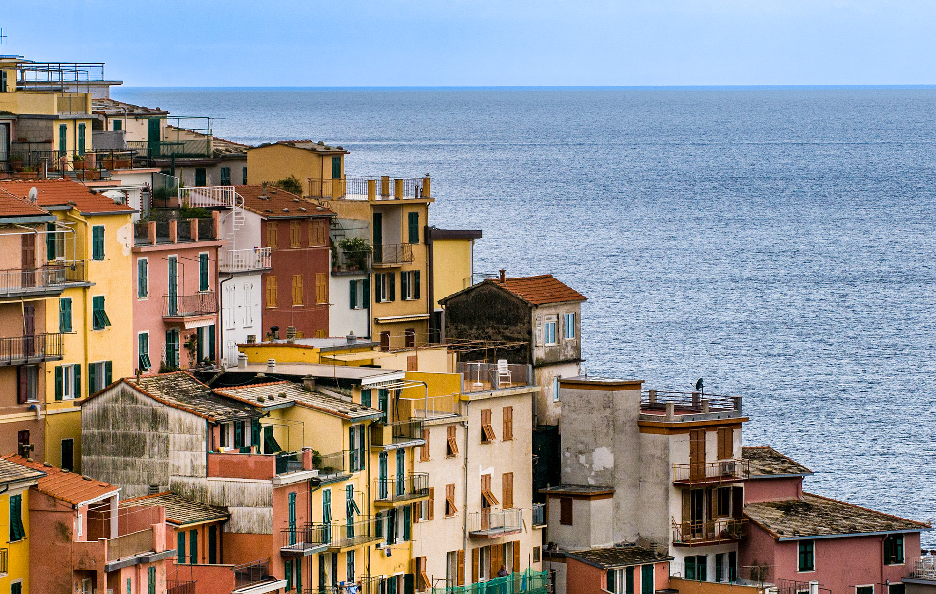 The villages of Cinque Terre on Italy’s Ligurian coast present stacks of colorful houses that spill down the steep hillsides. This is a portion of the town of Manarola.