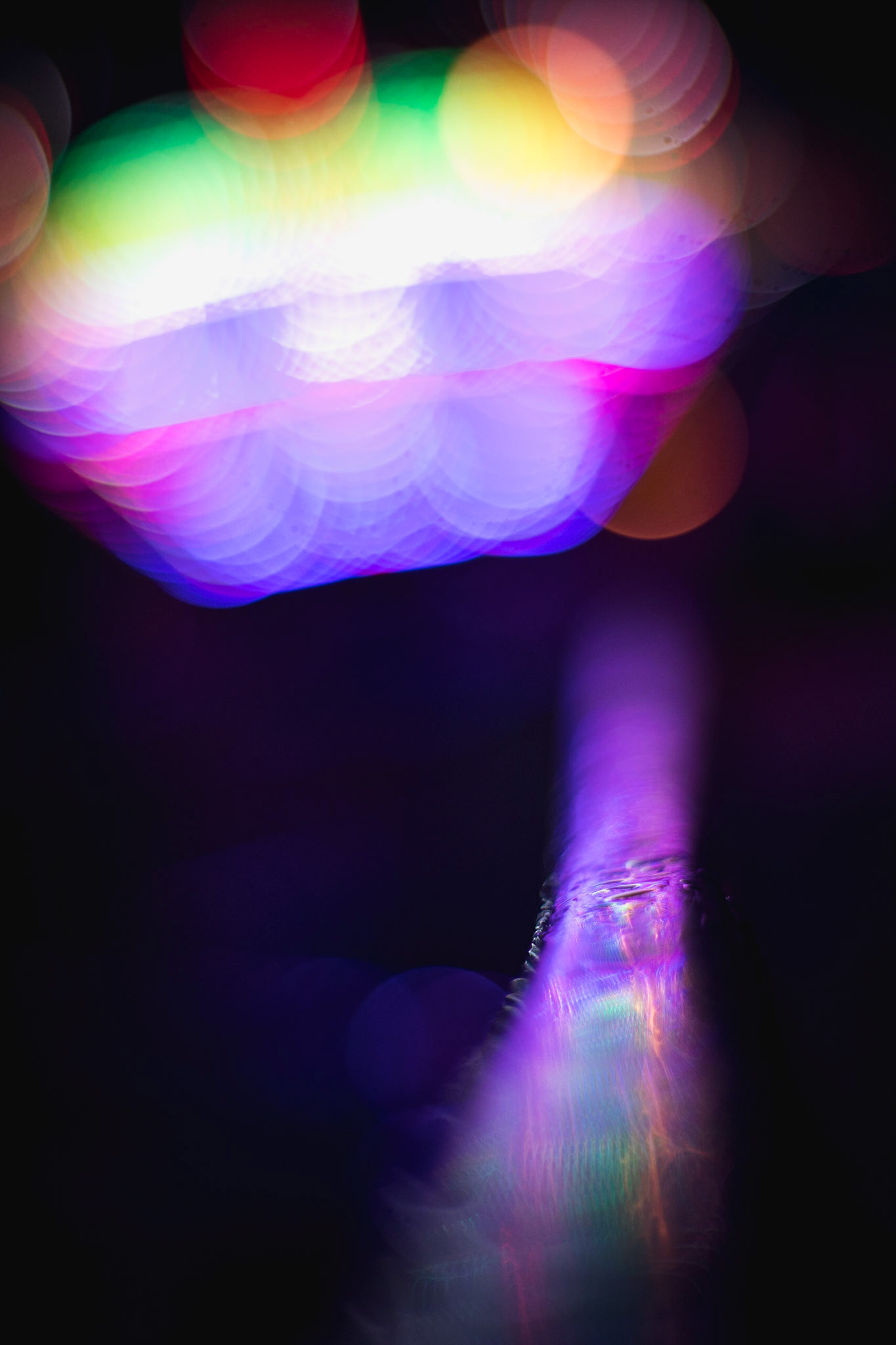 There's just something magical about the way light gets captured at f1.2. Even if you can't tell what exactly is going on the light looks like it's painted in, and at least for me, that's beautiful.