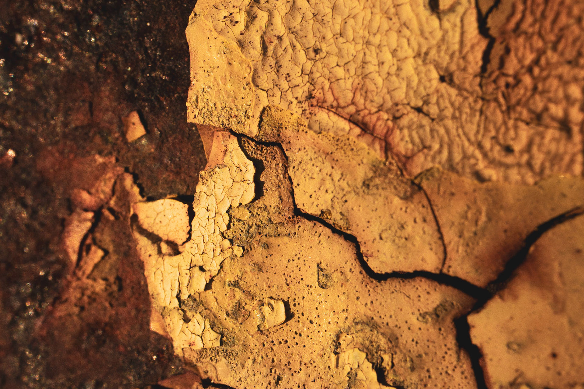 Yellow paint chipping away, giving way to the rust underneath.
