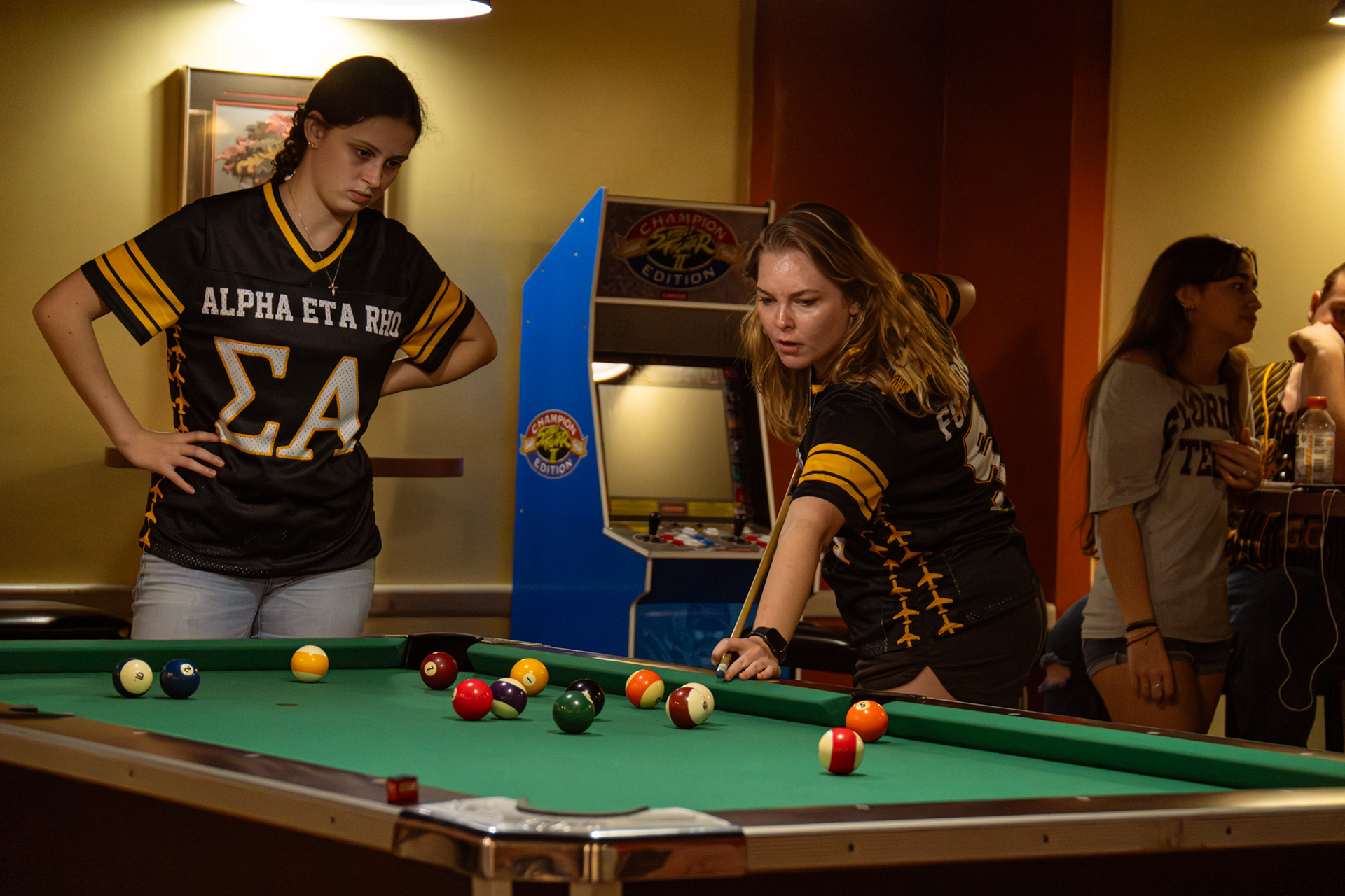 Women’s Alpha Eta Rho against Alpha Phi in the billiards final.