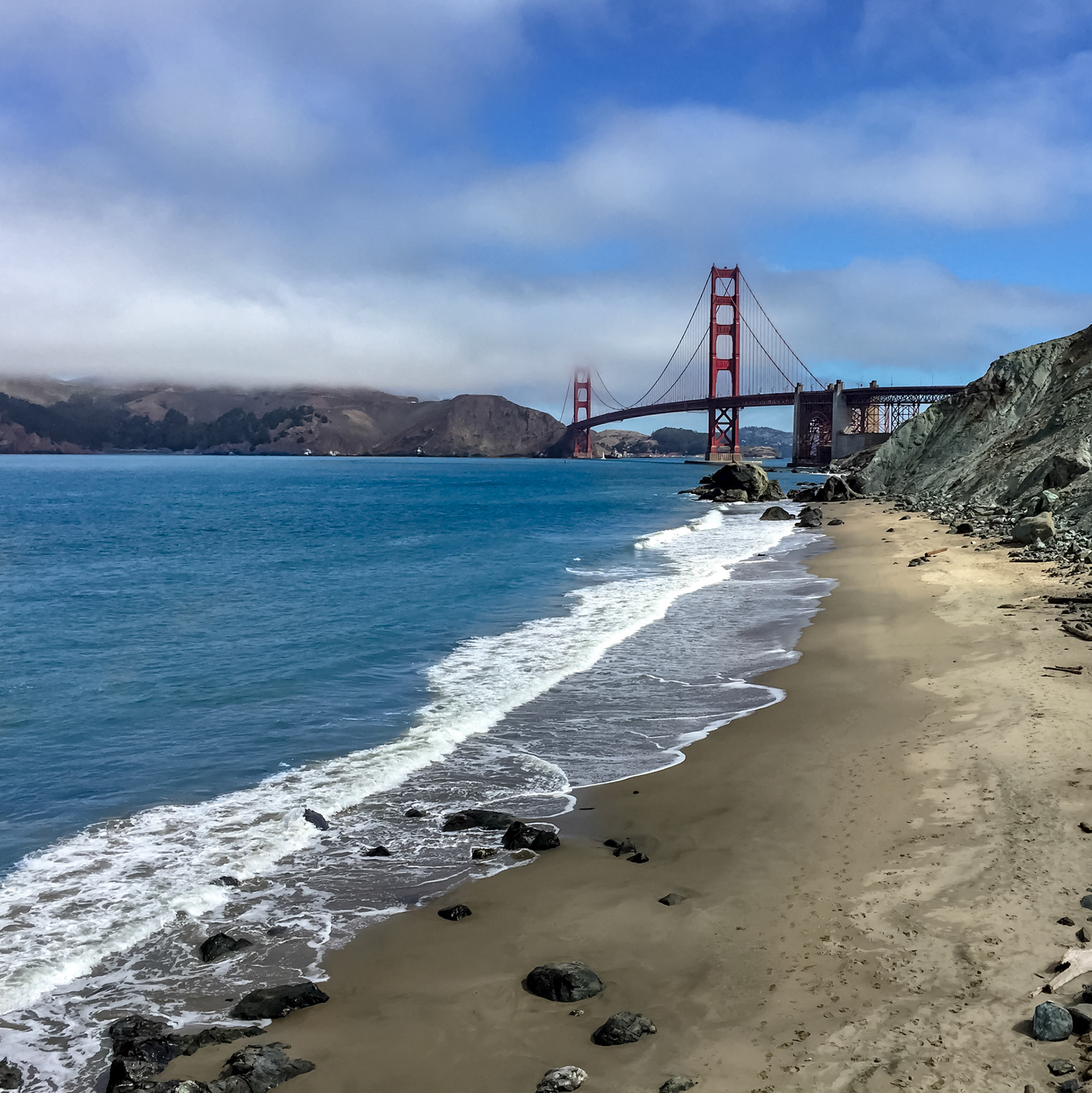 Even during a day with moderate temperature beaches like this are not empty. So I used Touch Retouch App to remove 6 people from this beach to get the nice, empty beach mood.