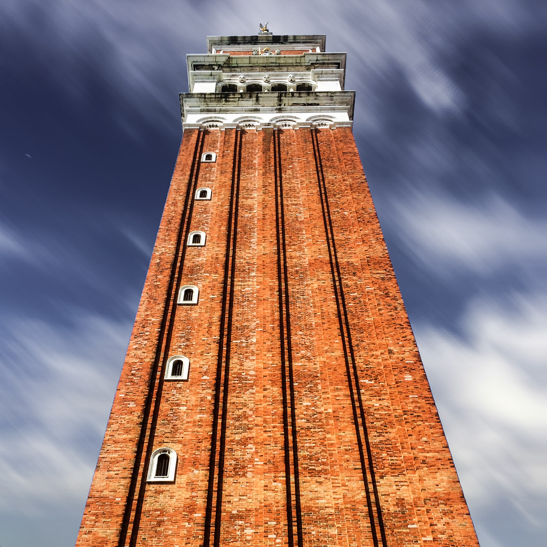 Well, you can wait for hours to get a moving cloud shot like this in Venice or you use an App like Pixelmator to create an effect like this.