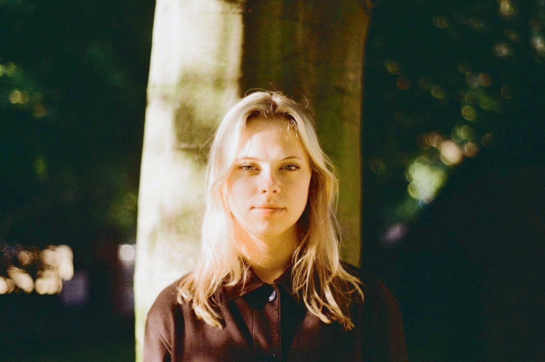 Polina Savicka, composer and music teacher, portrait outdoors in natural light