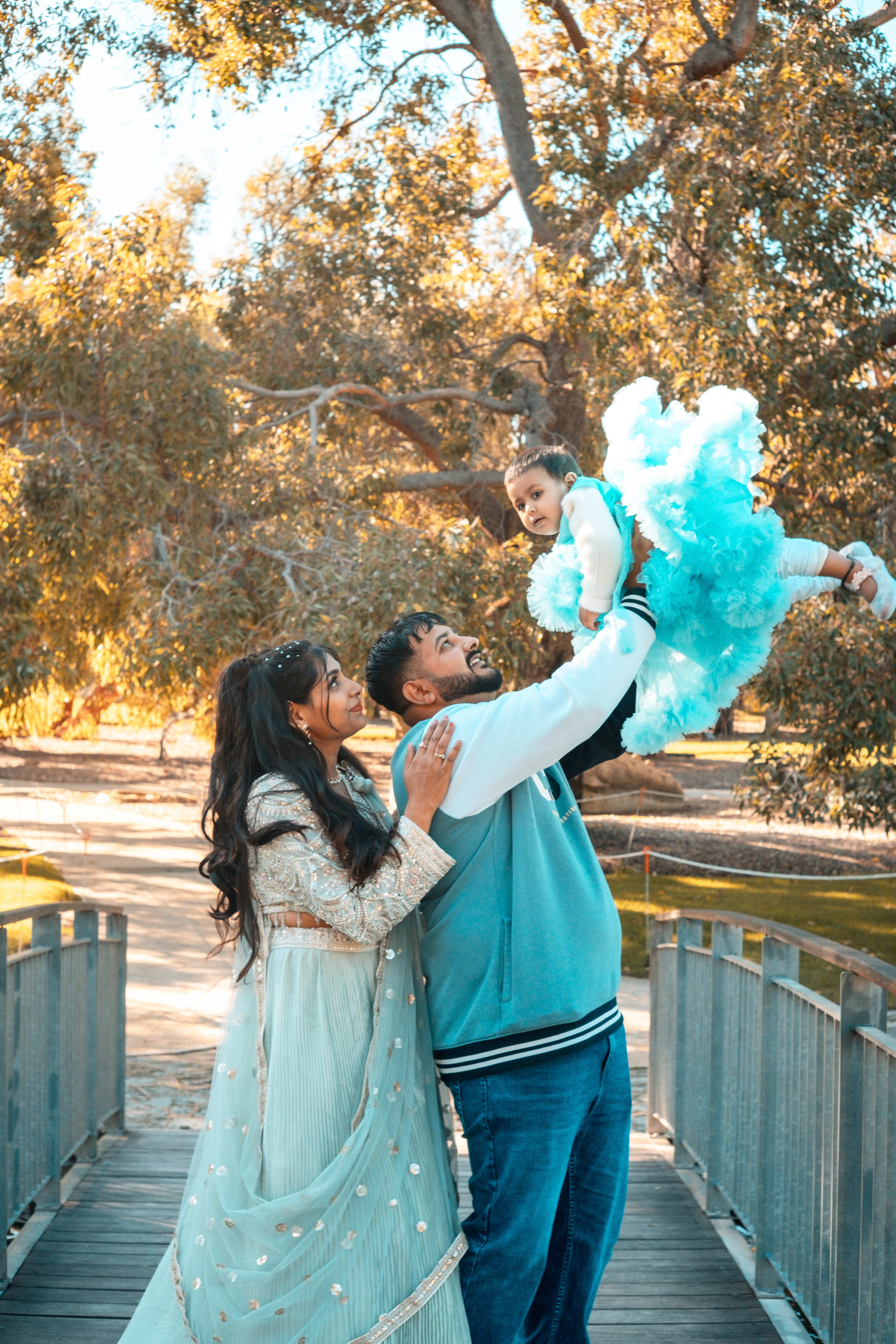 Father lifting daughter in the air at Kings Park during a sunny birthday session