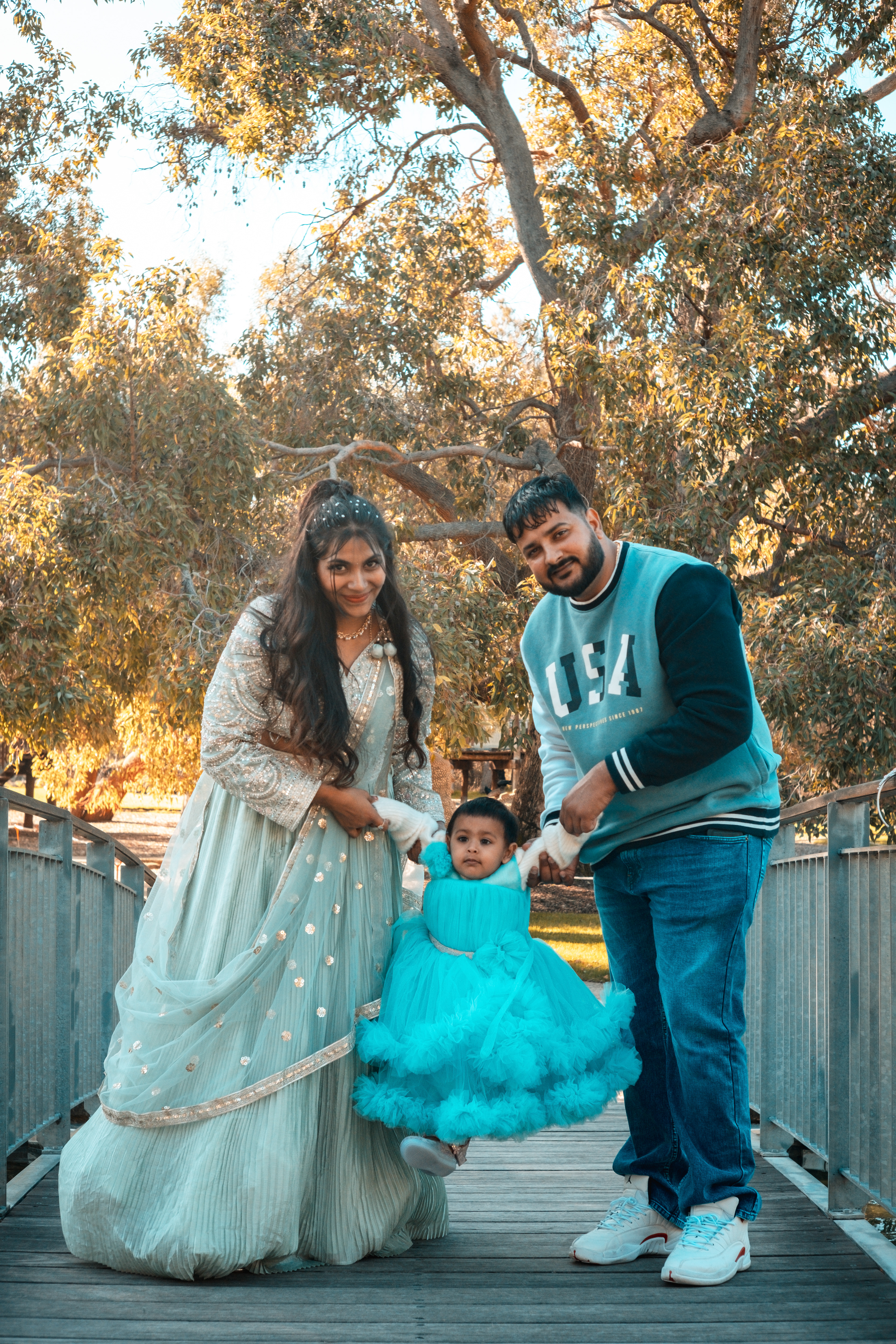 Smiling family with their birthday girl in a blue dress – Kings Park, Perth.