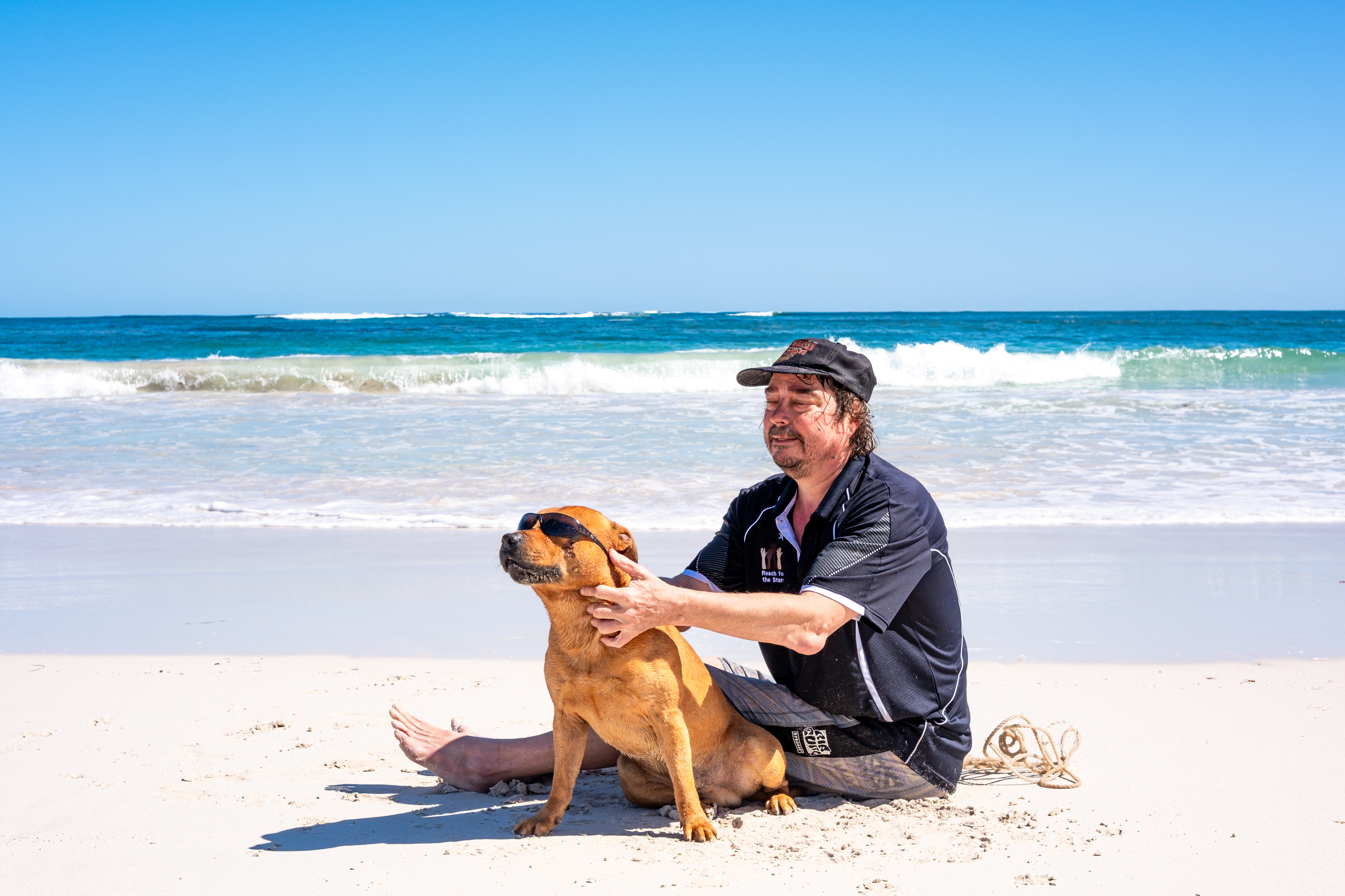 Beachside dog with sunglasses – a relaxed afternoon in Lancelin.