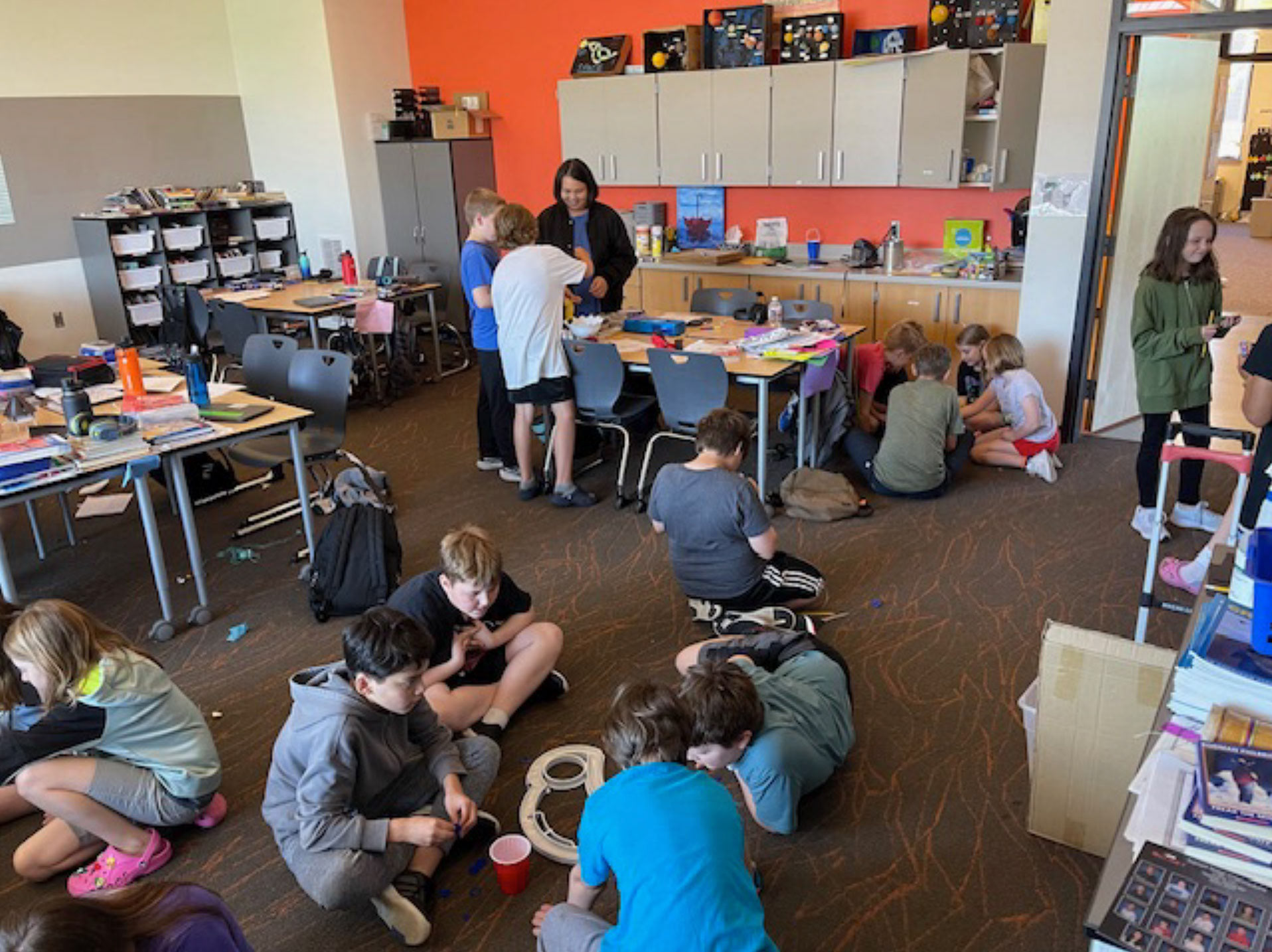 The 5th-graders in their teams, enjoying their creations before putting the park together in its final form.