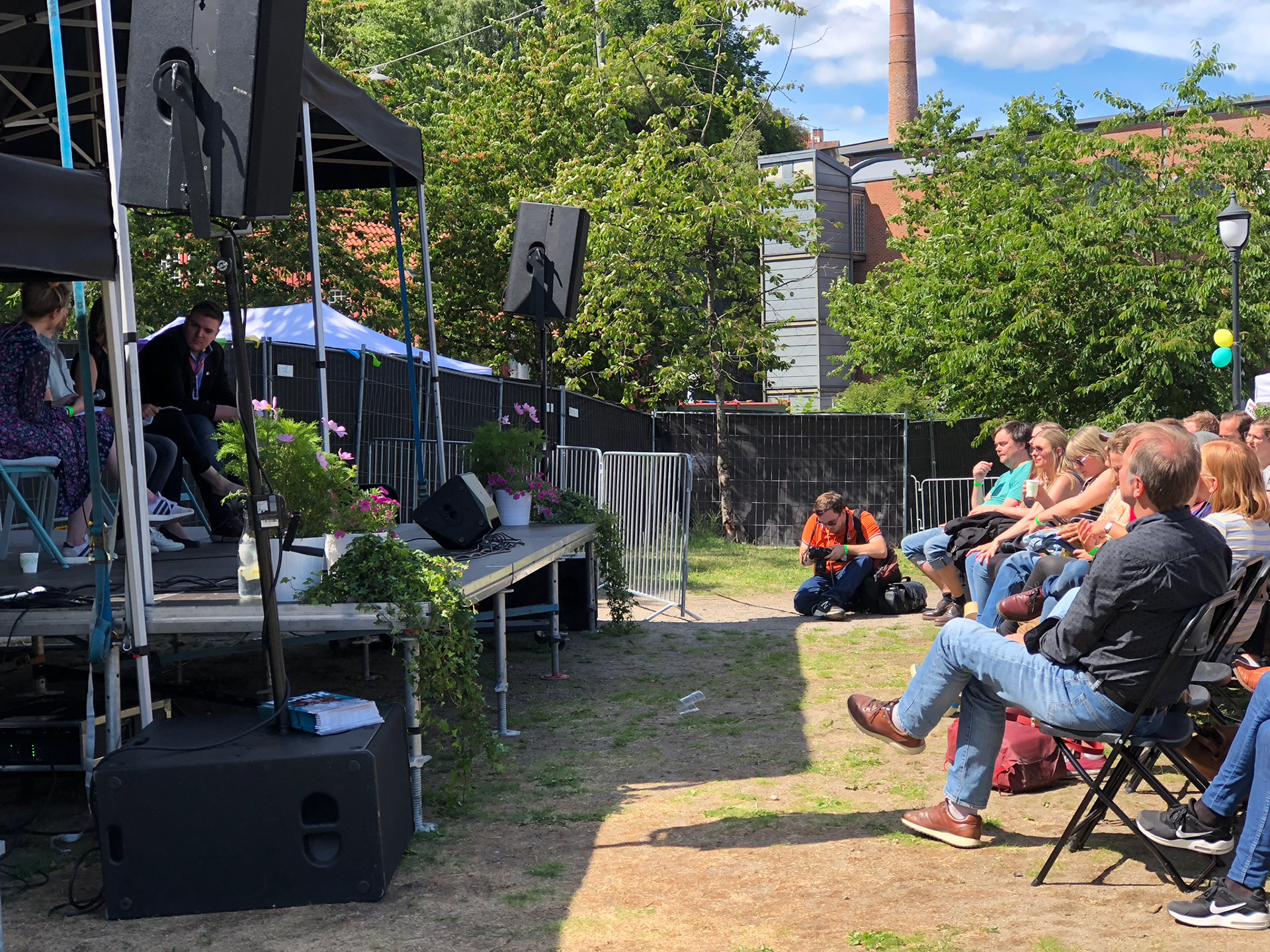 Ethan Reddish shooting panel at Red Party gathering.