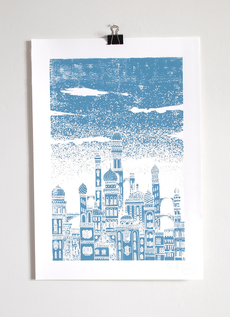 Brightly coloured wooden block print of an imaginary city, inspired by the mythology of the planet Neptune
