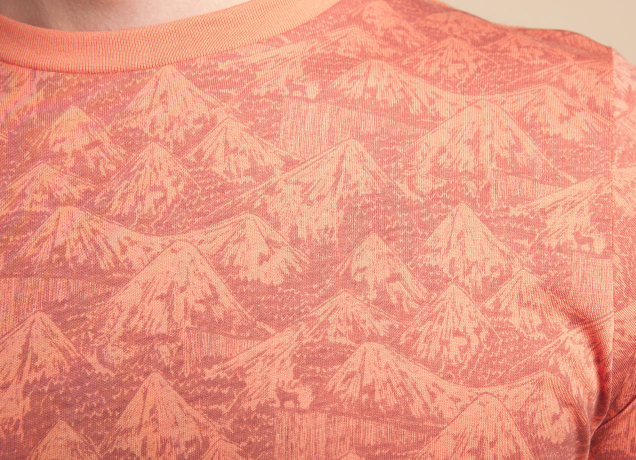 Detail of Horror Vacui illustration on orange t-shirt