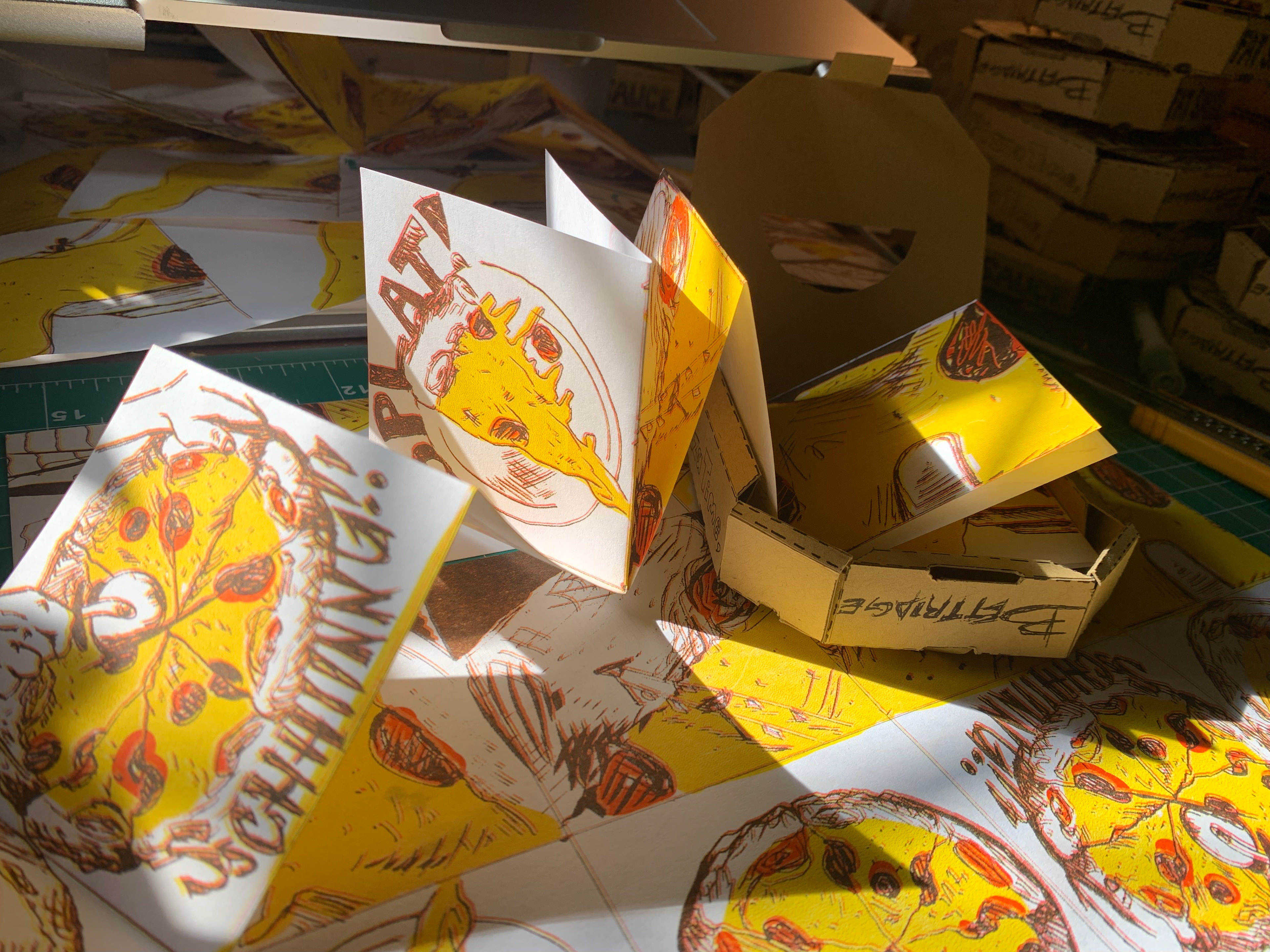 Zine and pizza box cover. Inner zine RISO printed with 4 layers of color.