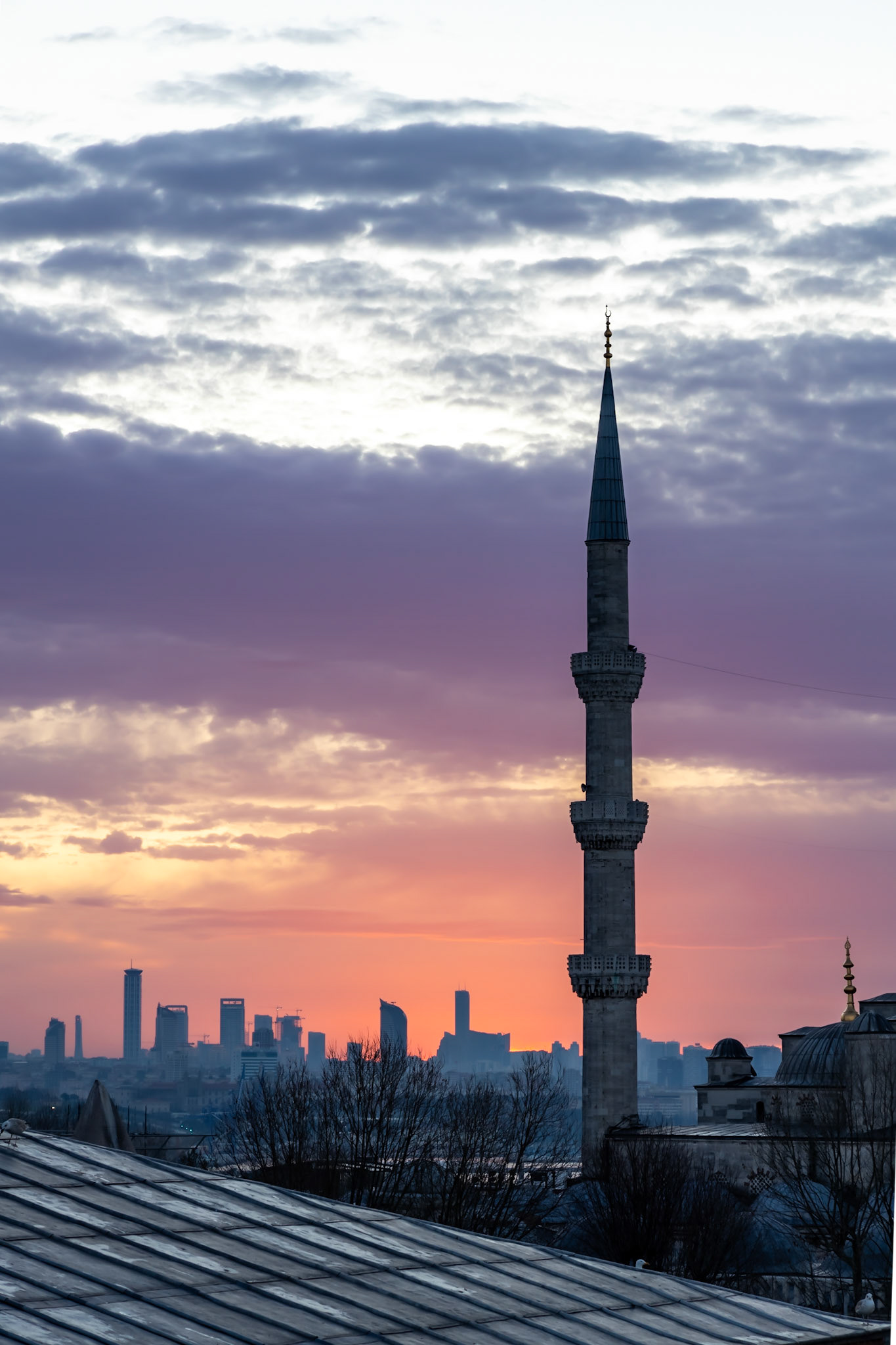 View on one of the six minarets of the Blue Mosque at sunrise in Istanbul. Built by Sultan Ahmet I in 1603-1617.