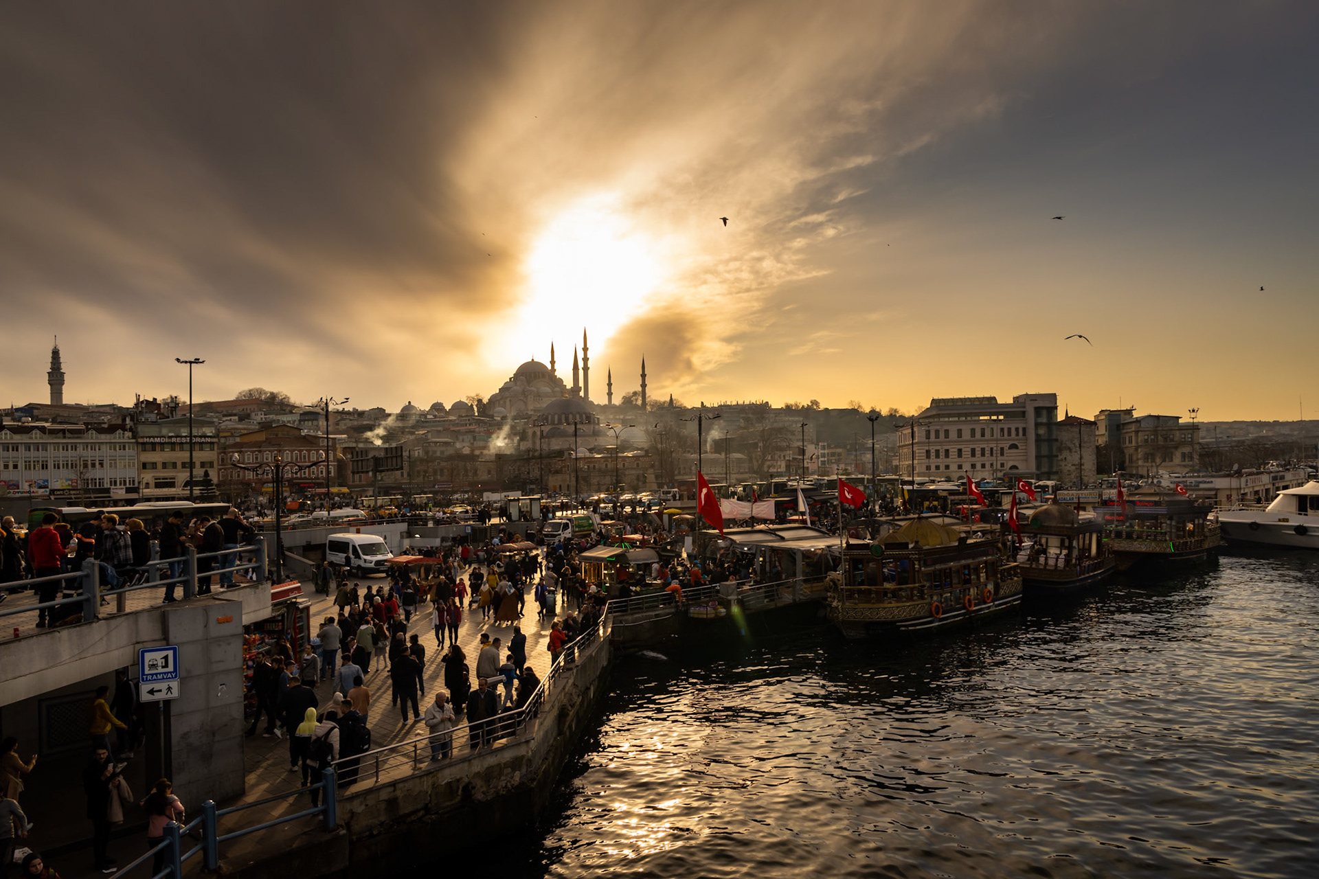Istanbul, Turkey - March 7 2020: Sunset over the old city center of Istanbul, seen from the Galata Bridge.