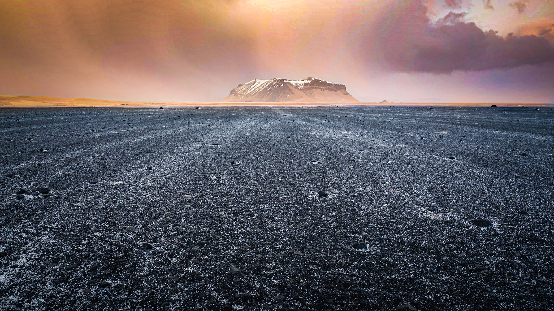 Winter sunset on the Solheimasandur plain after a hailstorm, South Iceland, Iceland