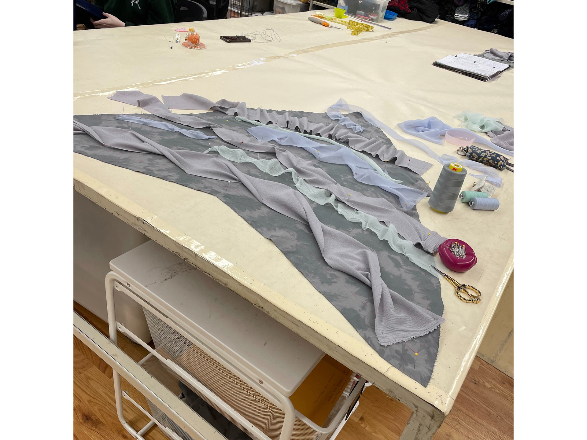 sheer fabric attached to fabric in organic forms to provide texture