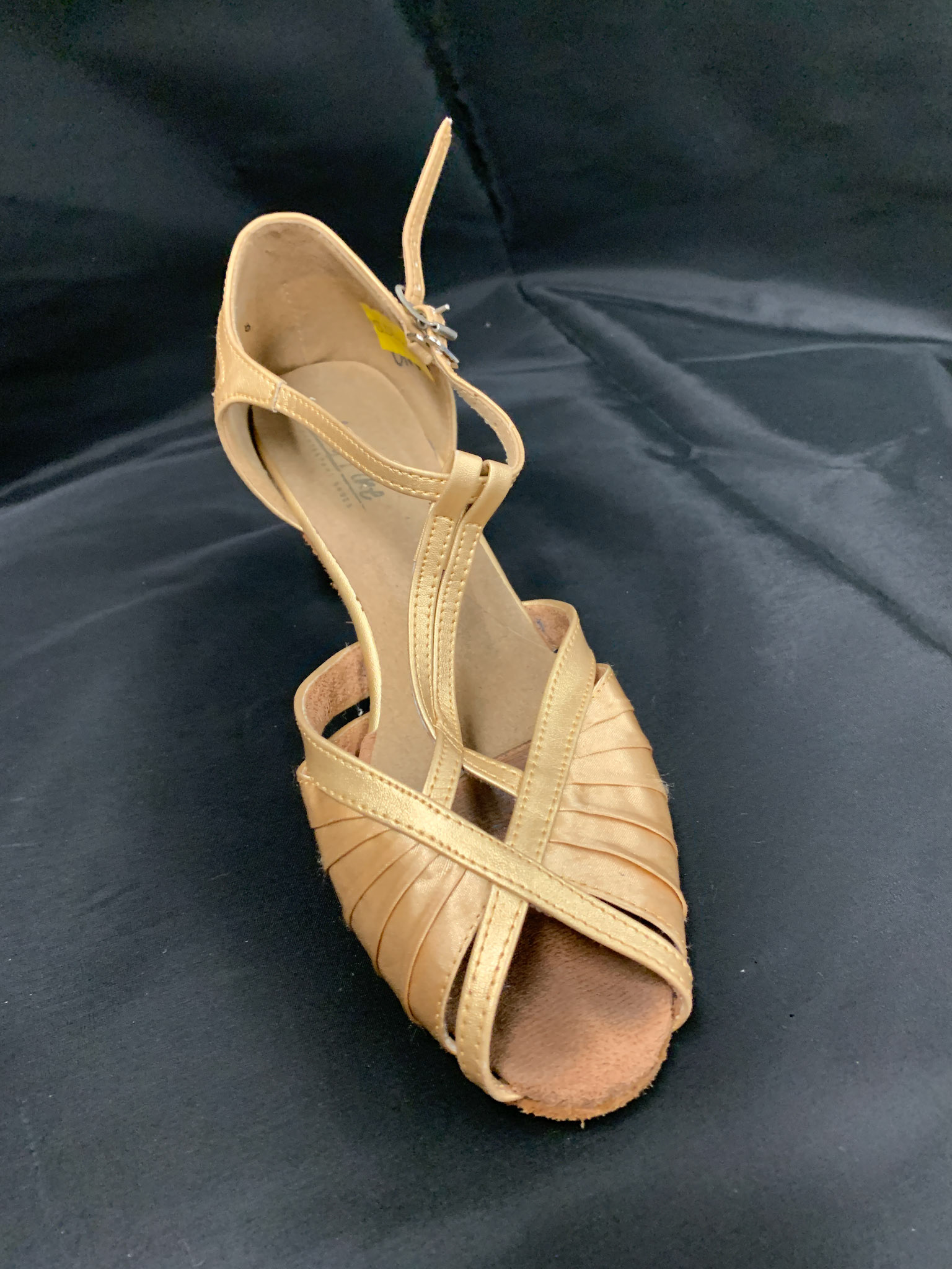 cream leather and cloth heals painted gold