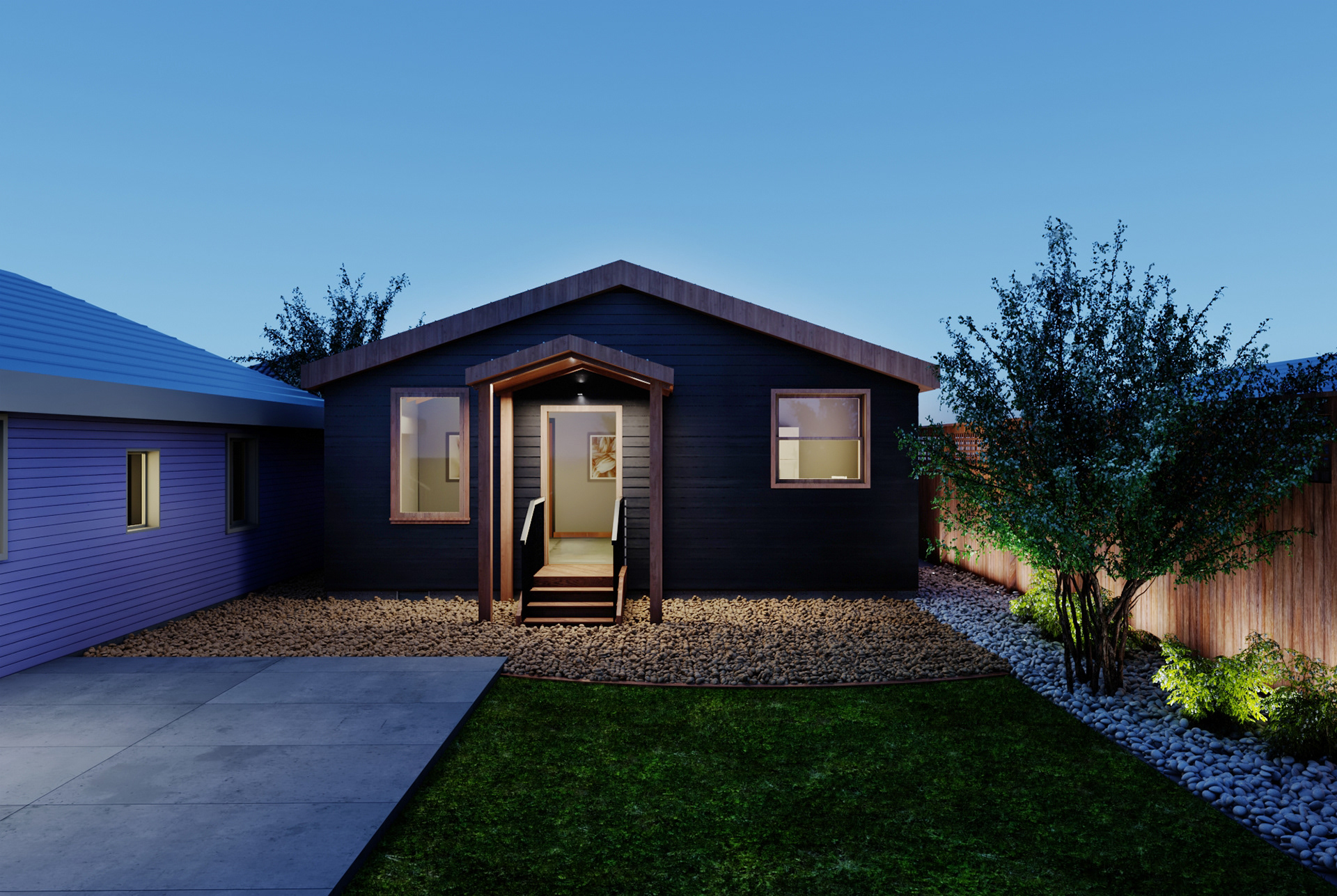 View of the Payran Accessory Dwelling Unit at night, showcasing the interior lighting and exterior design