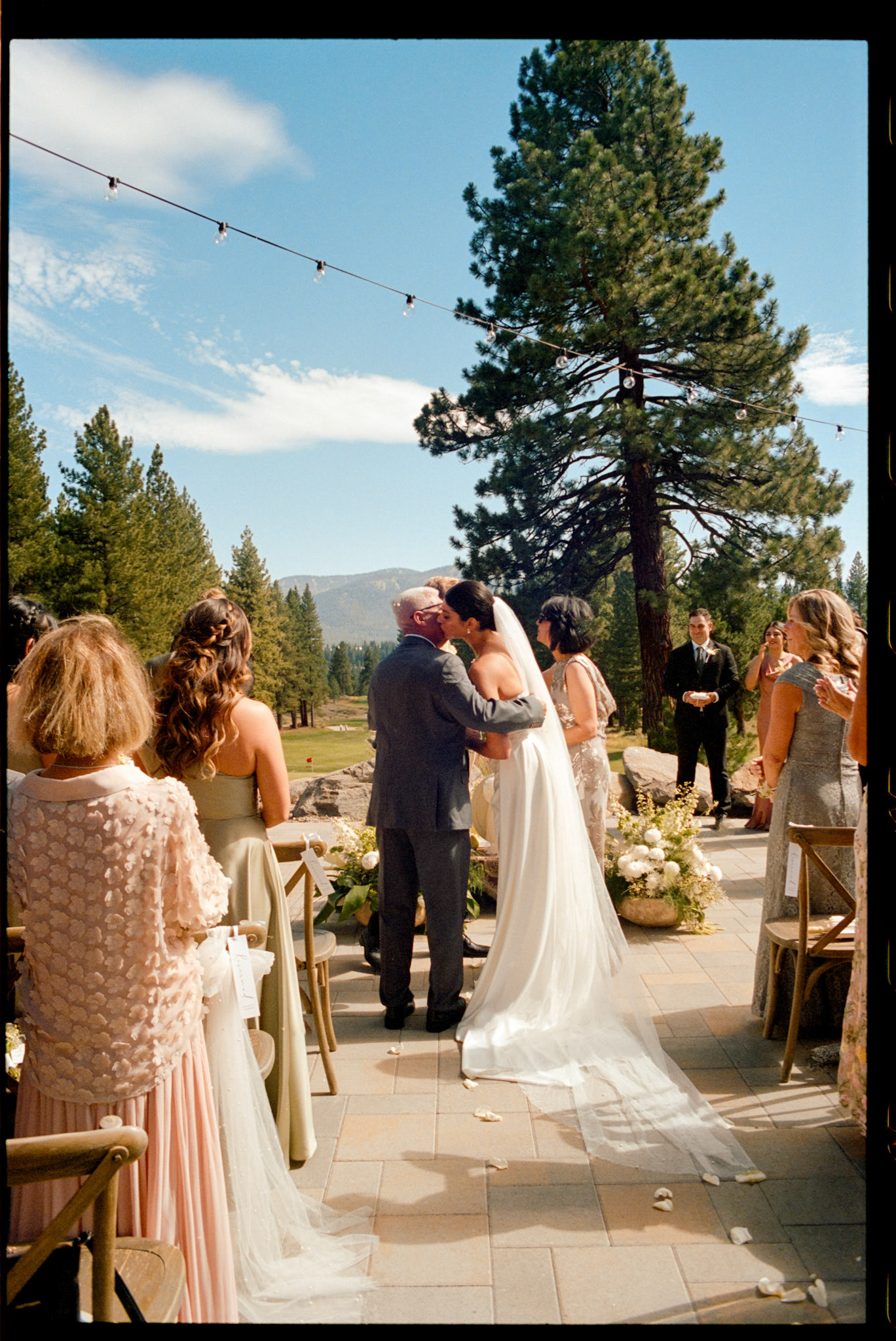 An open-air wedding ceremony beneath the pines at The Timbers at Old Greenwood.