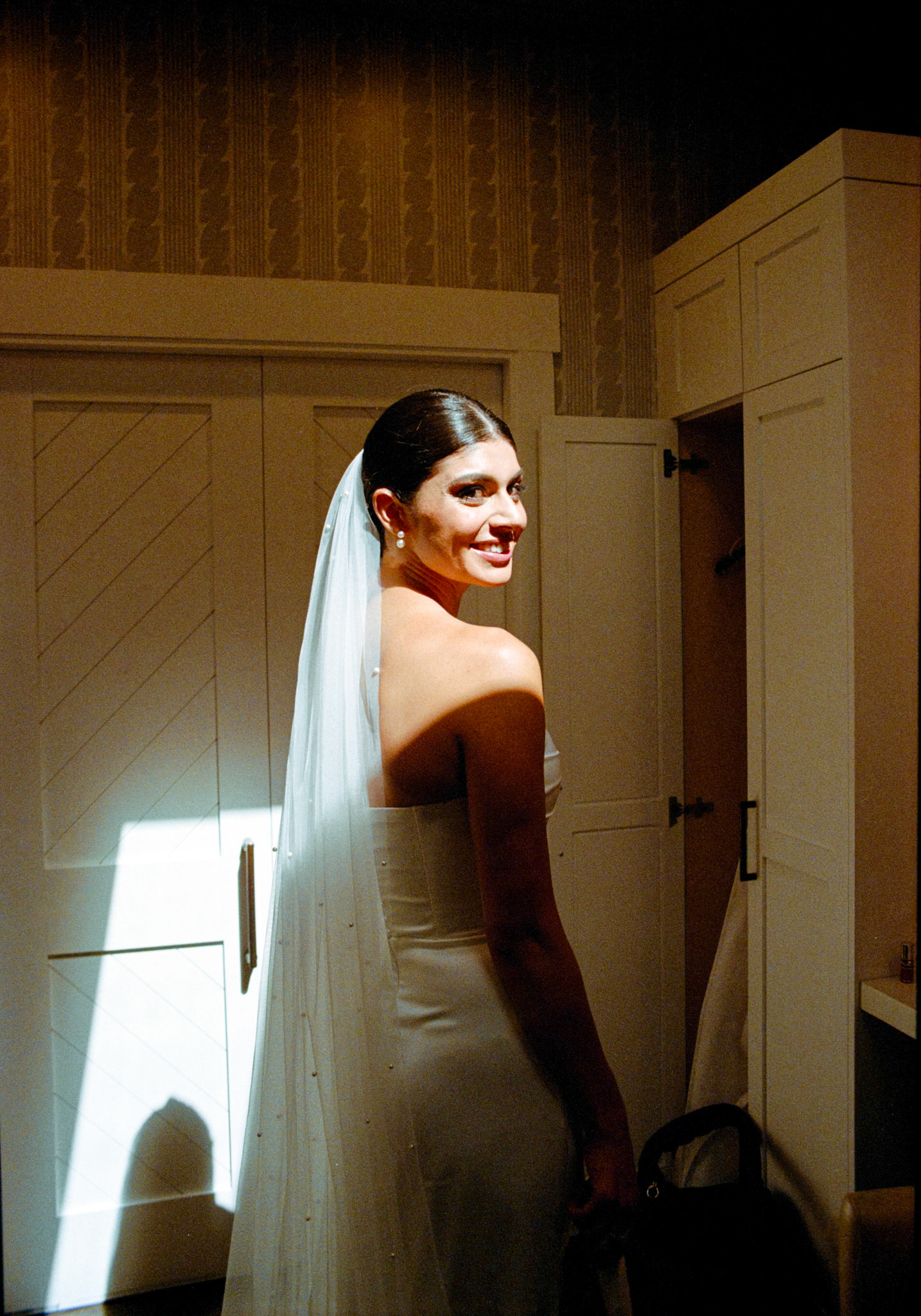 A Julie Vino wedding gown and morning preparations photographed on film in Truckee.