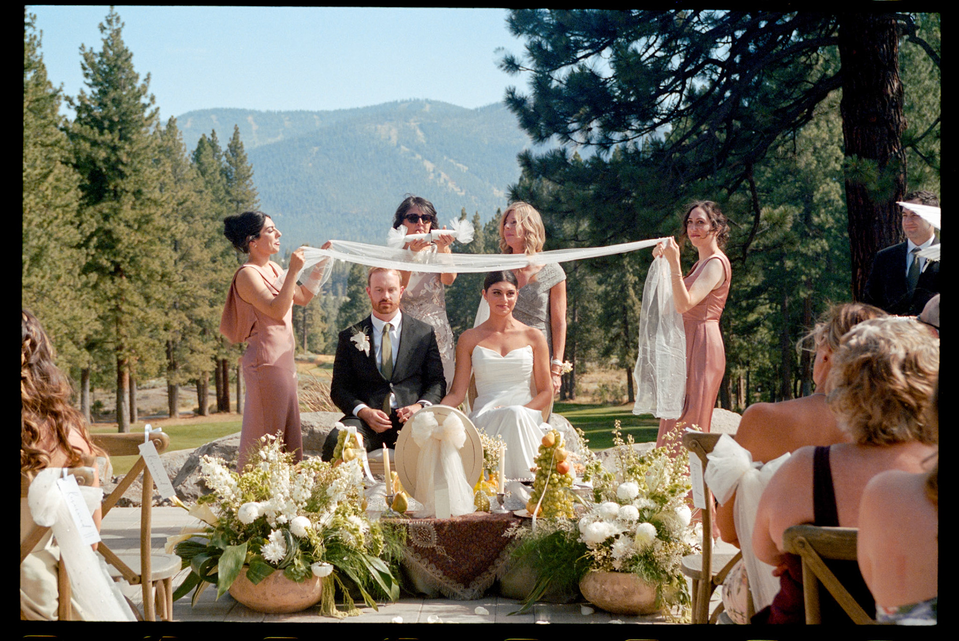 An open-air wedding ceremony beneath the pines at The Timbers at Old Greenwood.