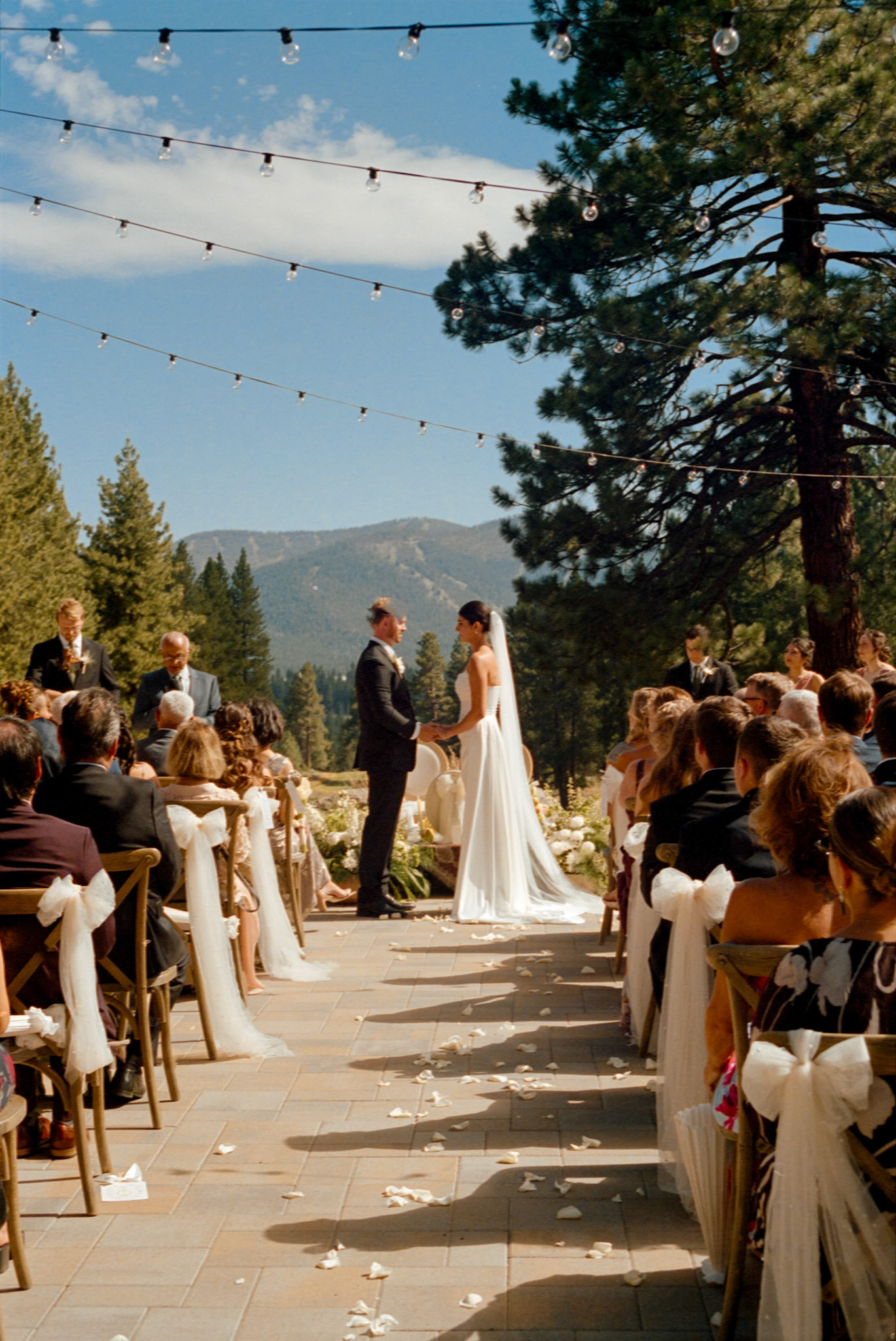 An open-air wedding ceremony beneath the pines at The Timbers at Old Greenwood.