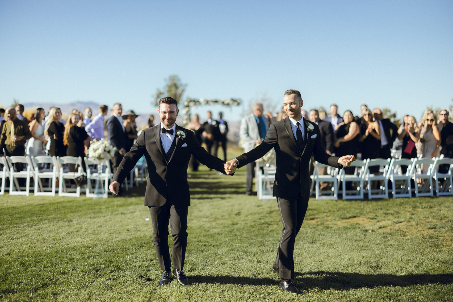 An outdoor wedding ceremony overlooking the Sierra Nevada at The Club at ArrowCreek.