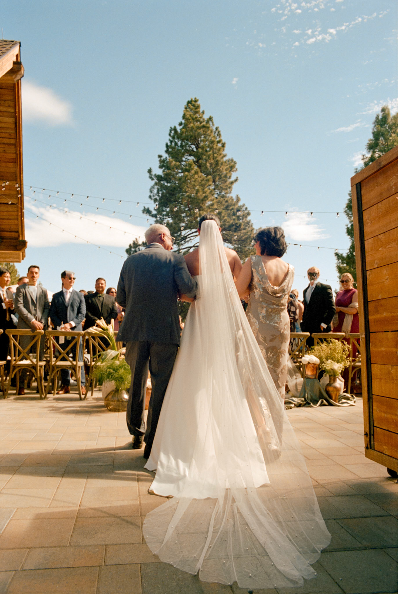 An open-air wedding ceremony beneath the pines at The Timbers at Old Greenwood.