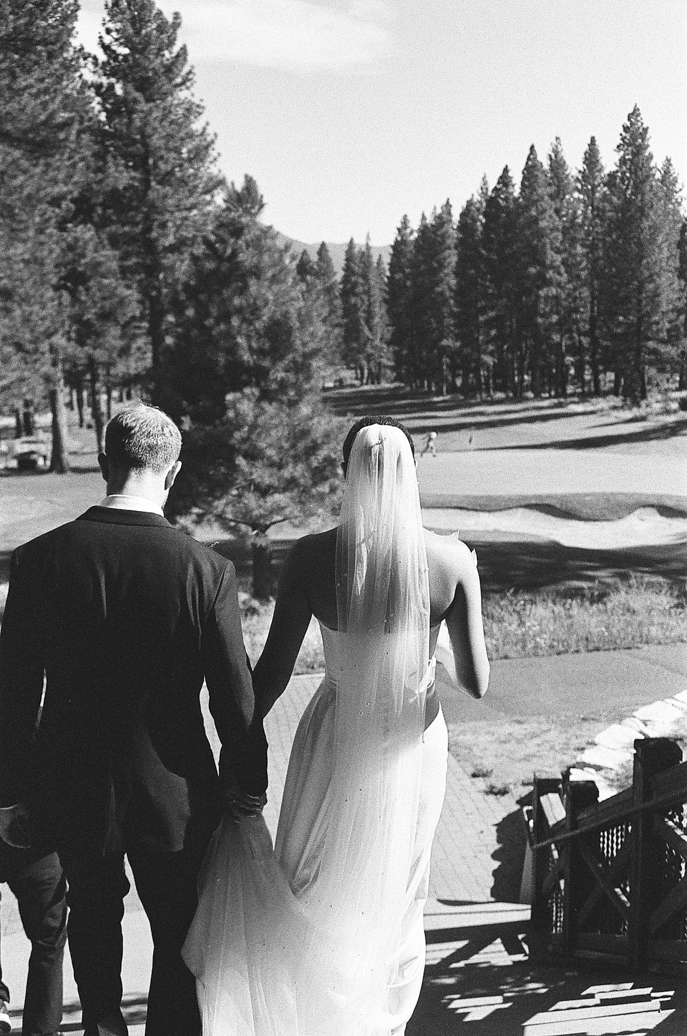 The newlyweds photographed on film among the towering pines and open fairways of Old Greenwood.