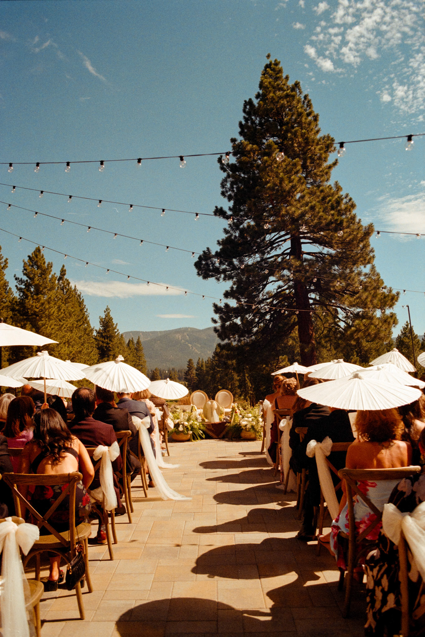 An open-air wedding ceremony beneath the pines at The Timbers at Old Greenwood.
