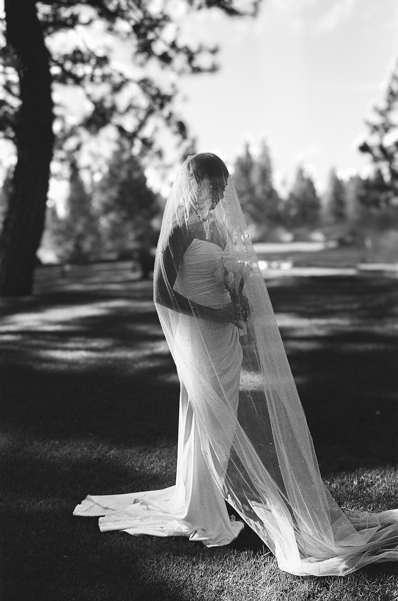 The newlyweds photographed on film among the towering pines and open fairways of Old Greenwood.