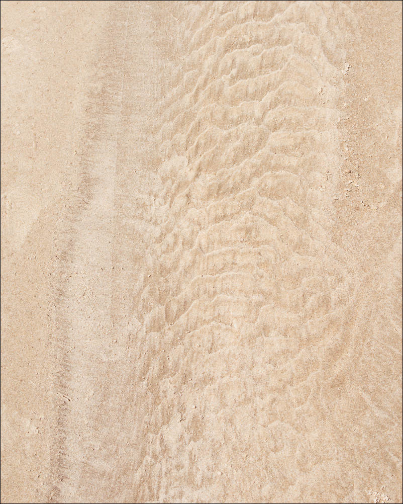 abstract flows in the sand left by the tides