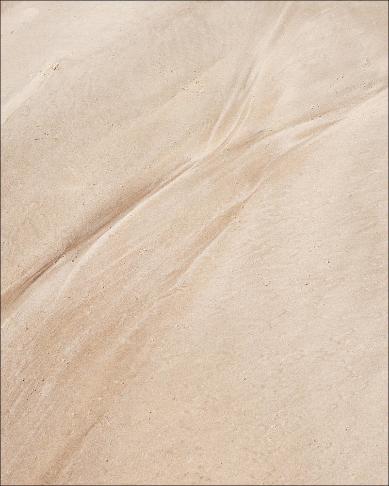 abstract flows in the sand left by the tides